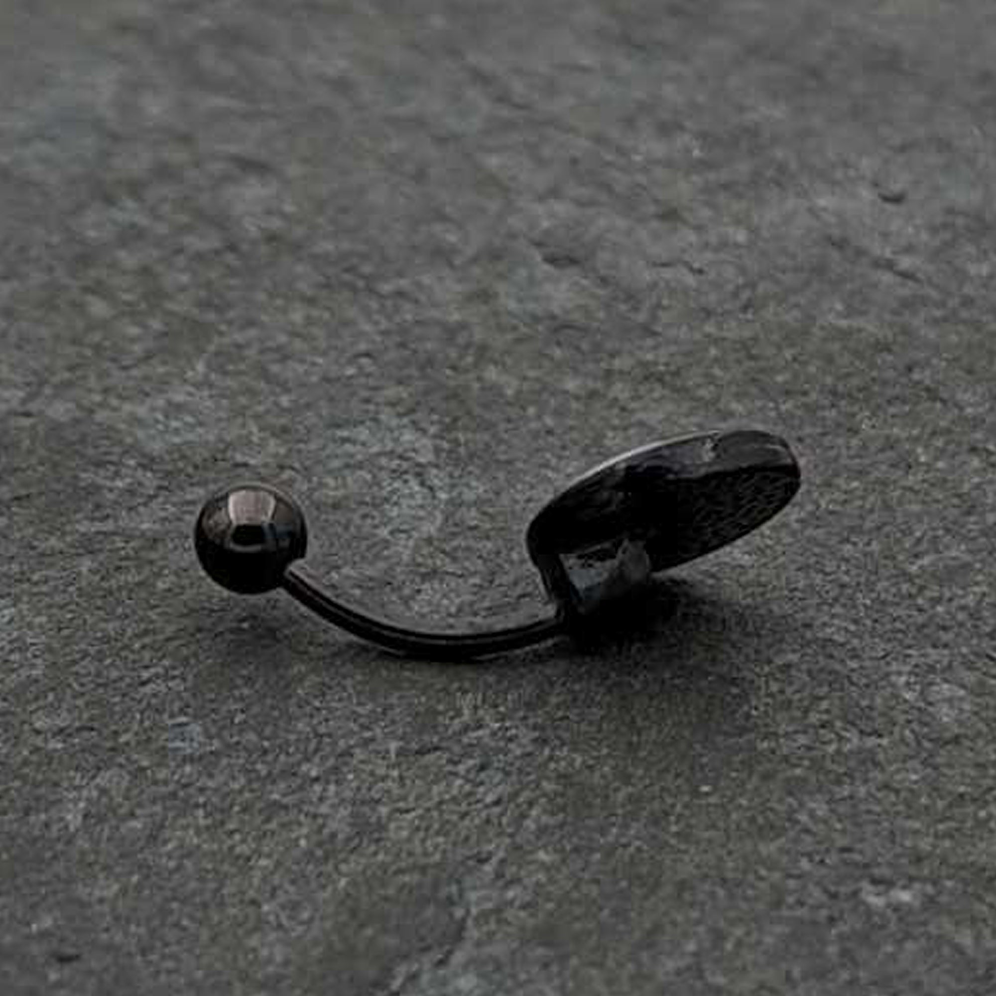 BodyCandy Black Glow in the Dark Holiday Peppermint Candy Belly Ring by Onyx O — in-use photo