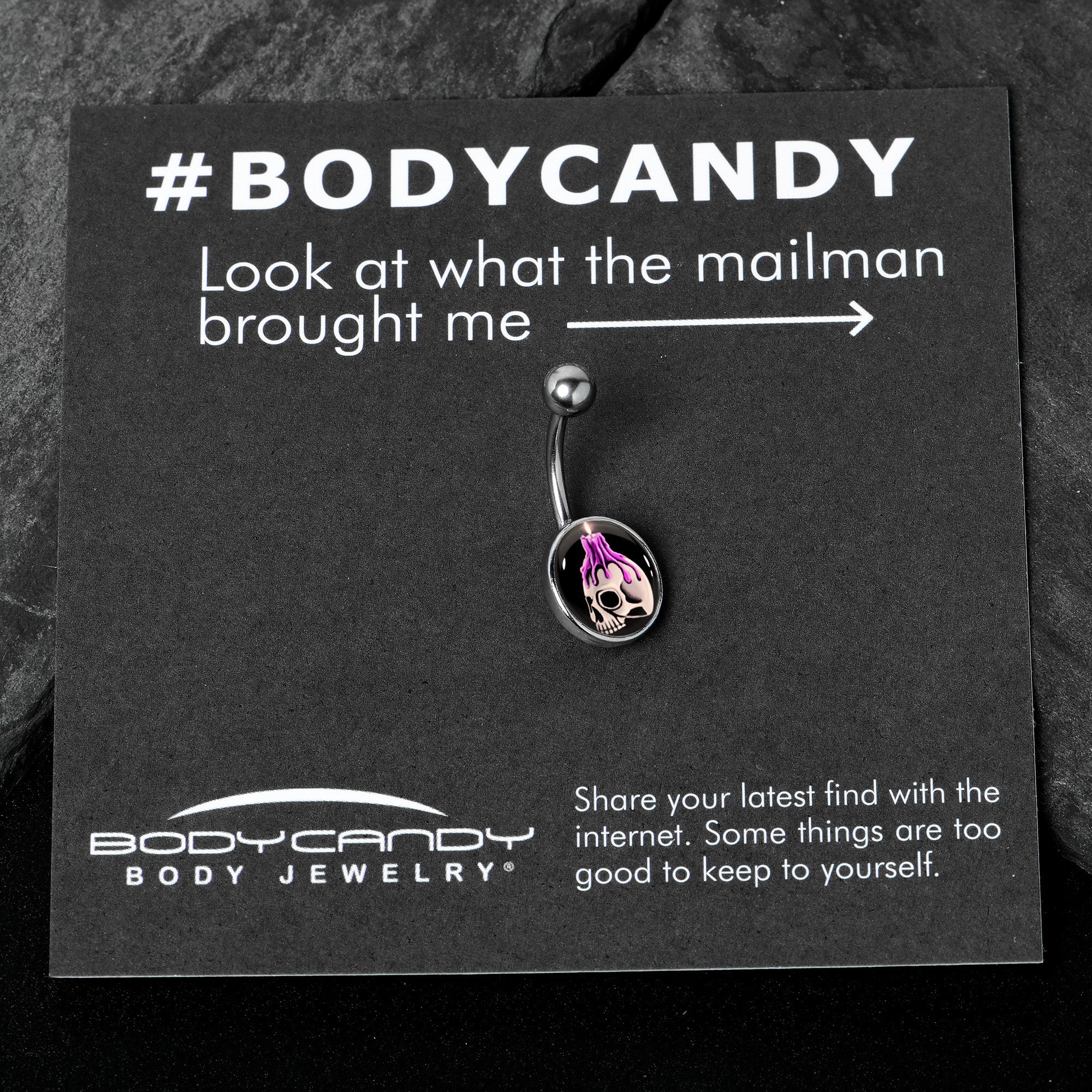 BodyCandy Burning Skull Candle Belly Ring by Onyx O — in-use photo