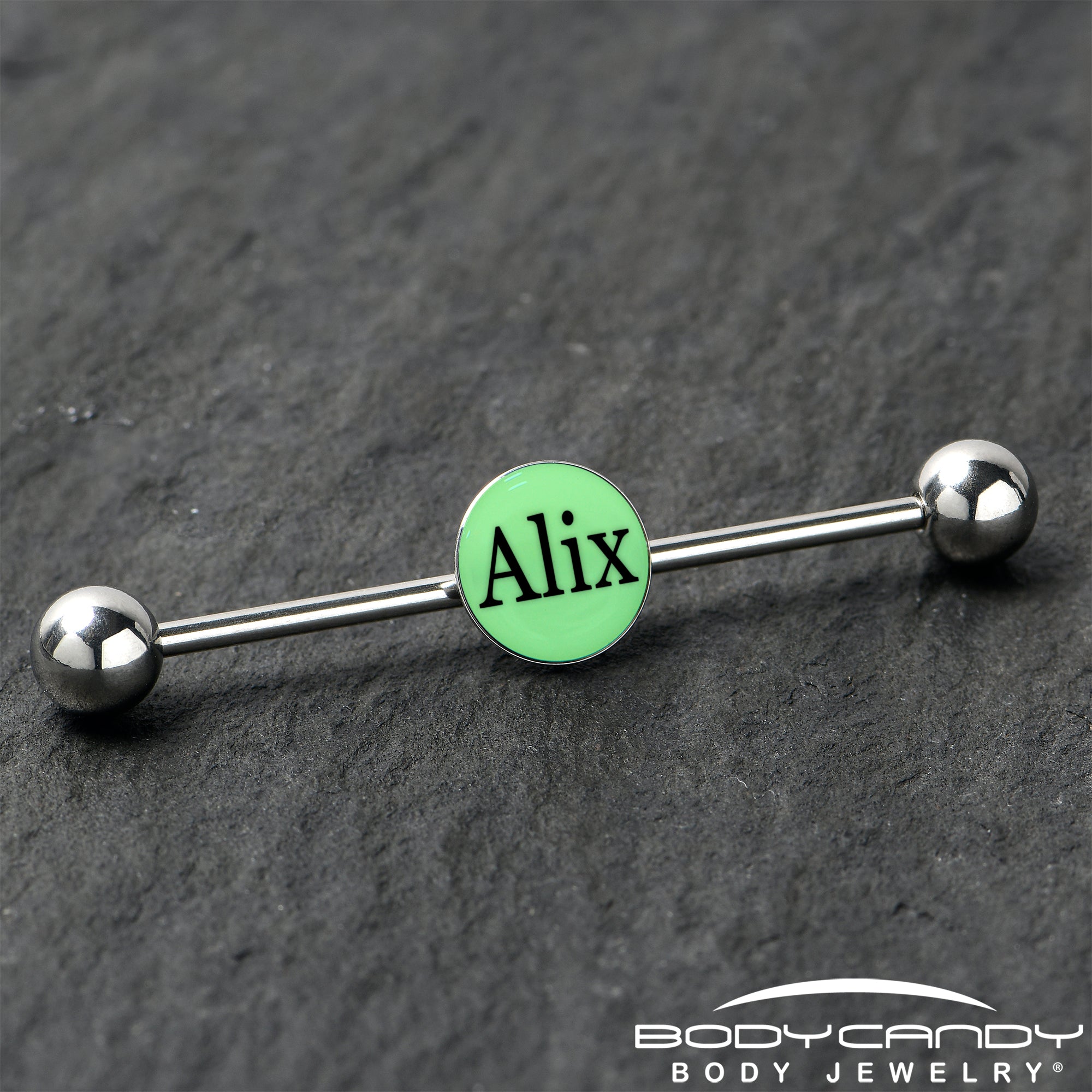 BodyCandy Custom Glow in the Dark Personalized Name Industrial Barbell — in-use photo