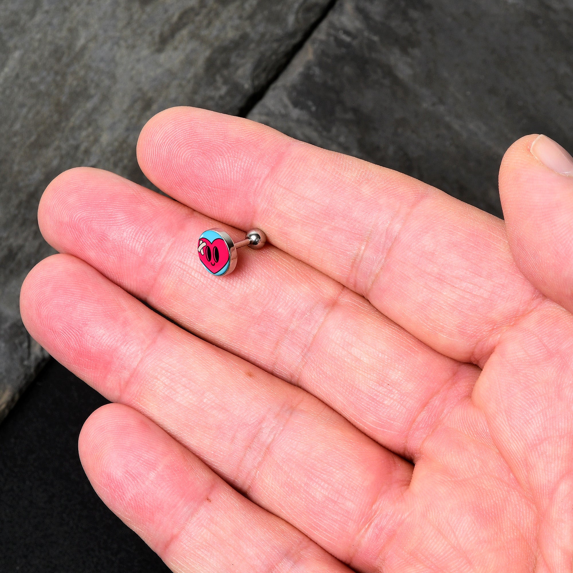 BodyCandy 16G 1/4 Heartbreak Bandaged Heart Cartilage Tragus Earring by Onyx O — lifestyle context