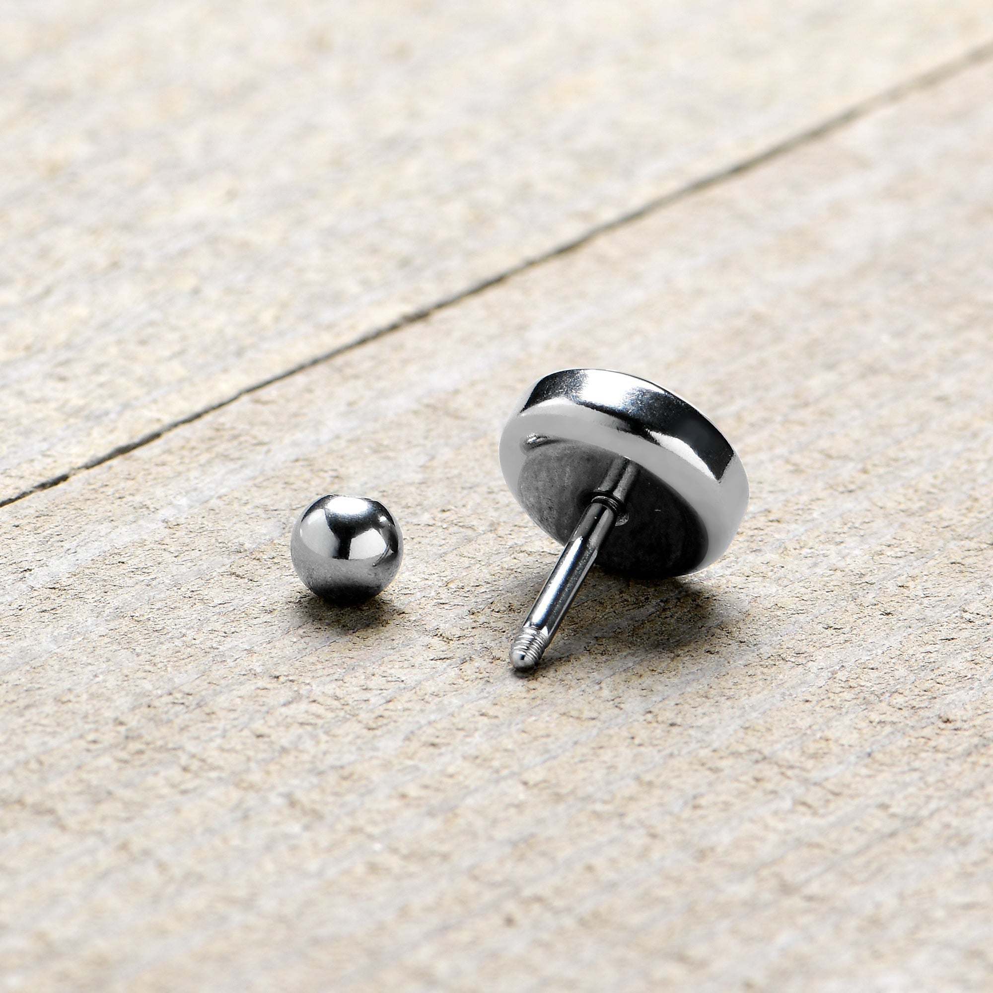 BodyCandy 16G 1/4 Alien UFO Dinosaur Abduction Cartilage Tragus Earring by Onyx O — in-use photo