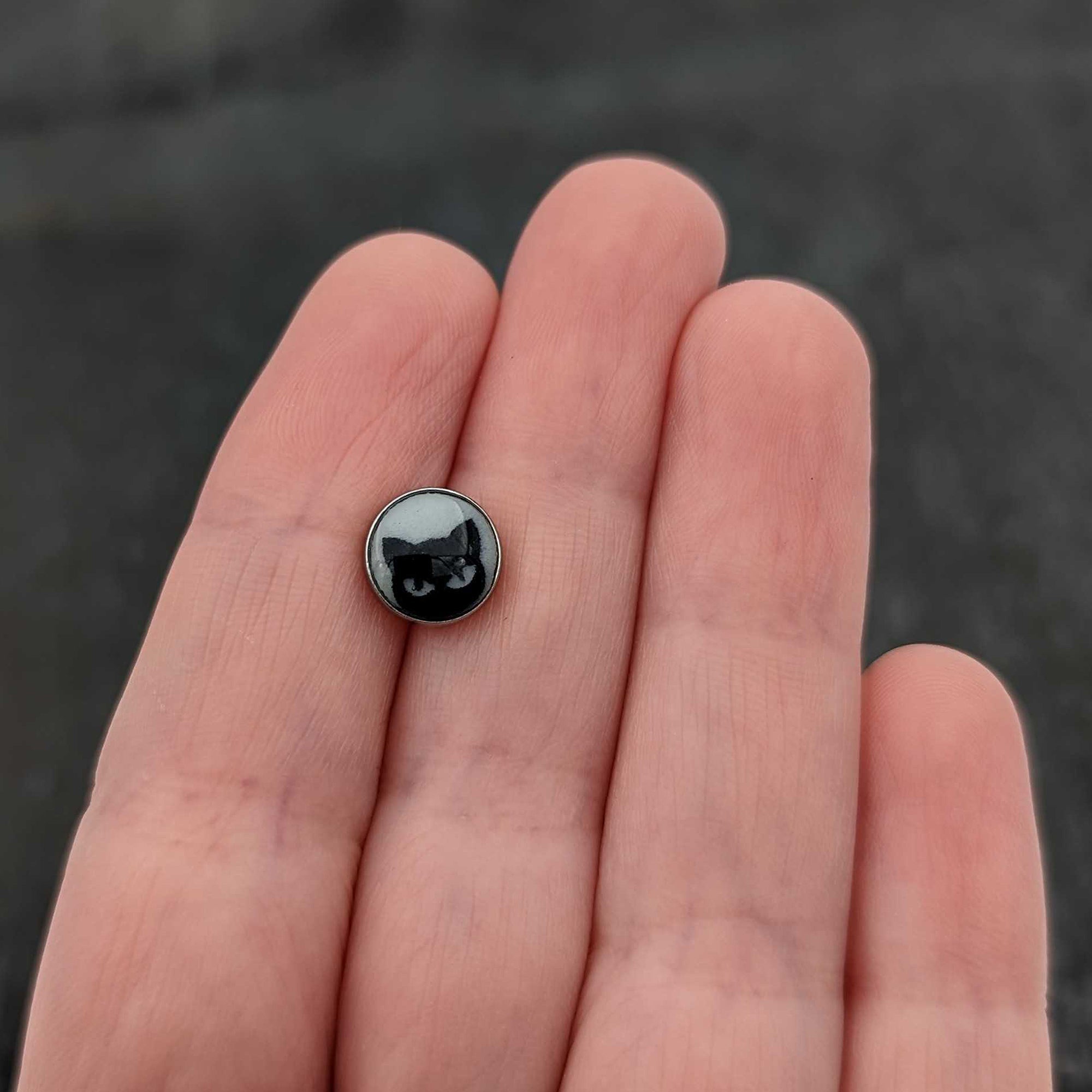 BodyCandy 16G Glow in the Dark Peeking Black Cat Tragus Cartilage Earring by Onyx O — in-use photo