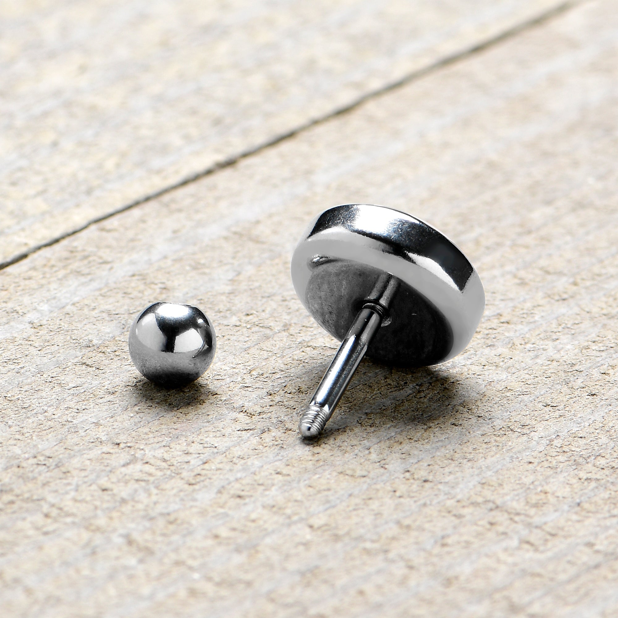 BodyCandy 16G 1/4 G.O.A.T. Cartilage Tragus Earring by Onyx O — in-use photo