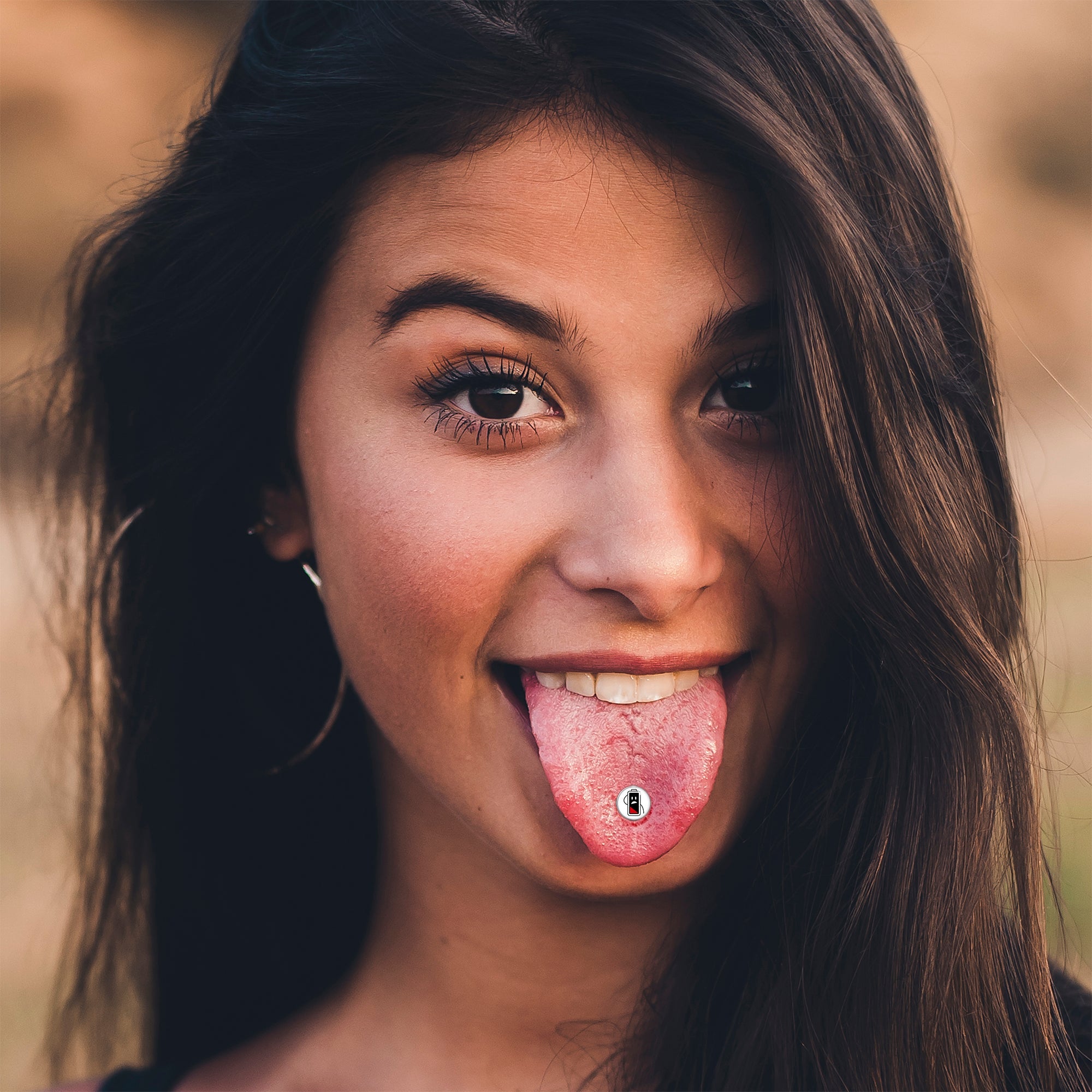BodyCandy Battery Empty Barbell Tongue Ring by Onyx O — lifestyle context