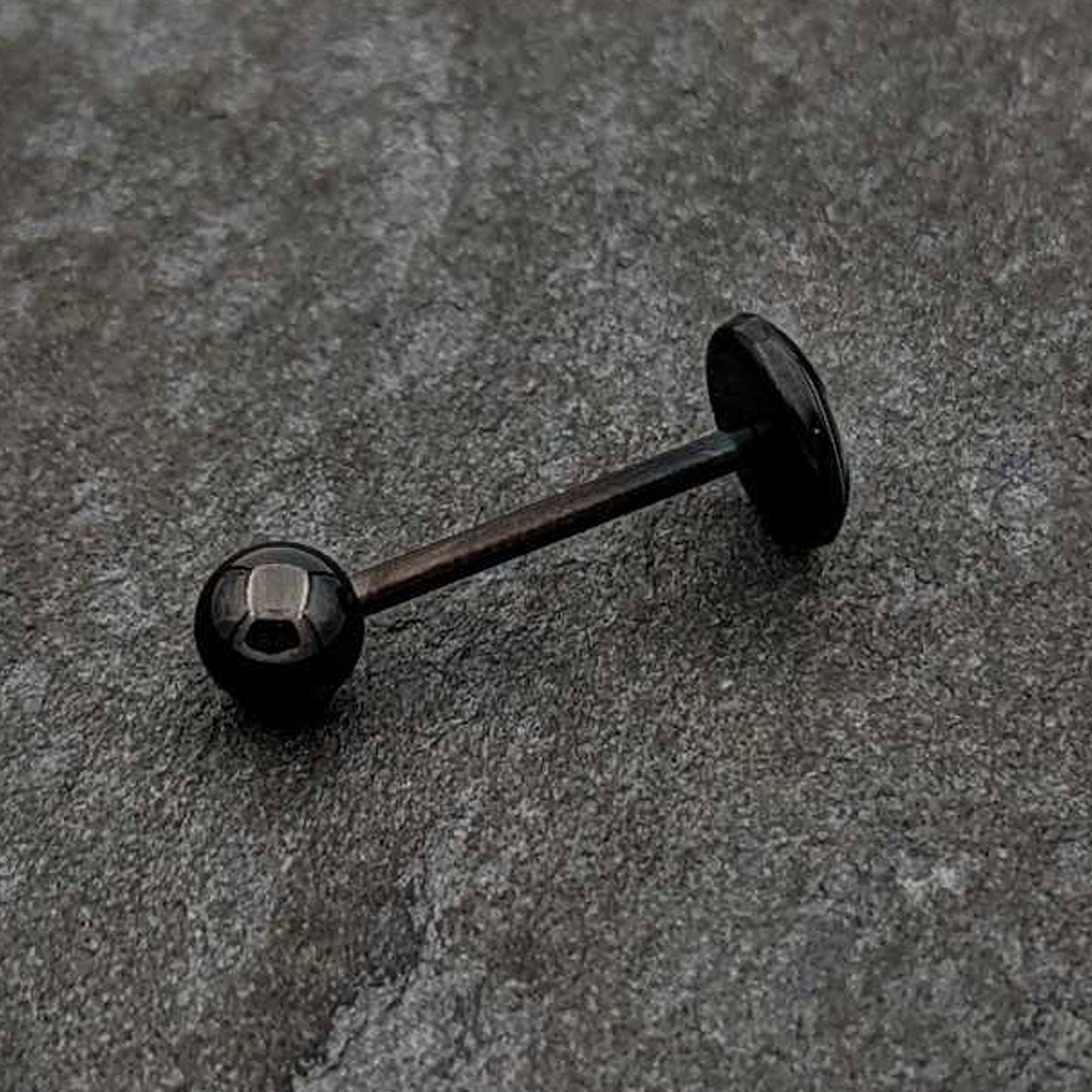 BodyCandy Glow in the Dark Black Anodized Radioactive Barbell Tongue Ring by Onyx O — color detail