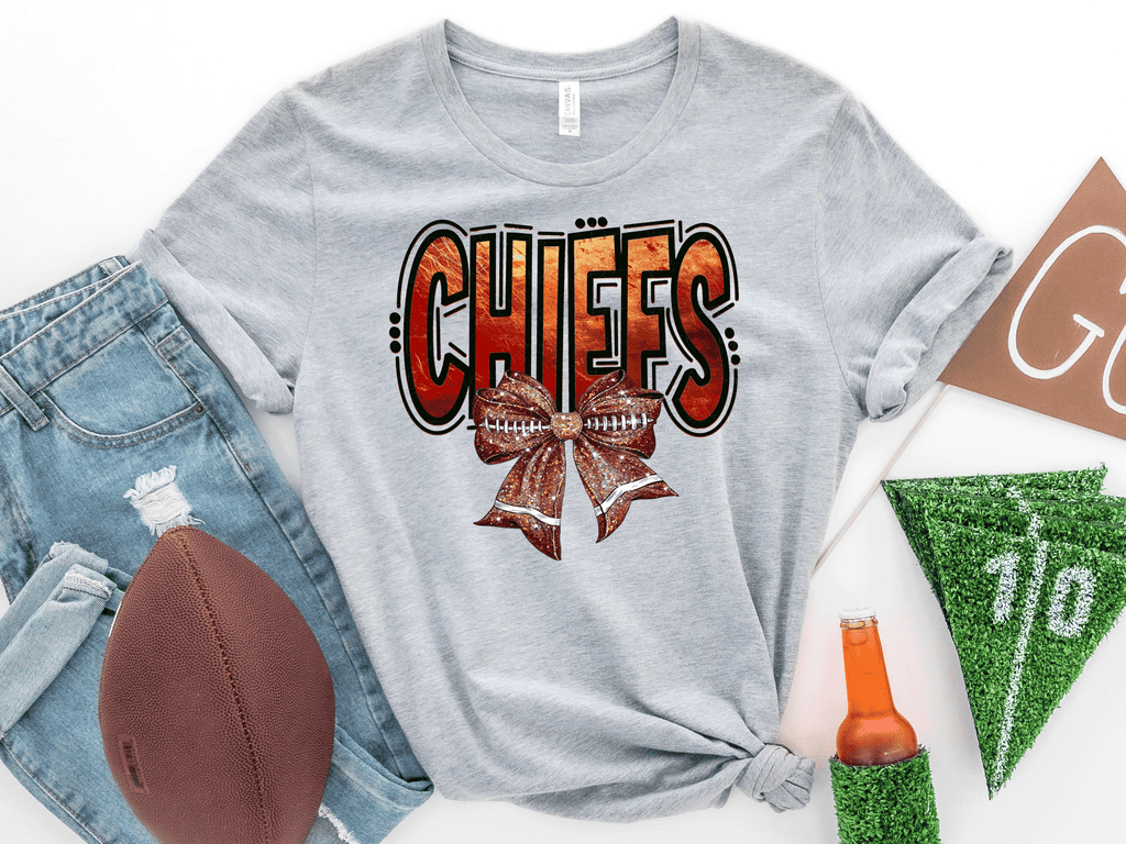 A Blessed Texas Mess Boutique Kansas City Football Metallic shirt, faux glitter football Coquette bow Shirt,… — dtf / graphic shirts category context