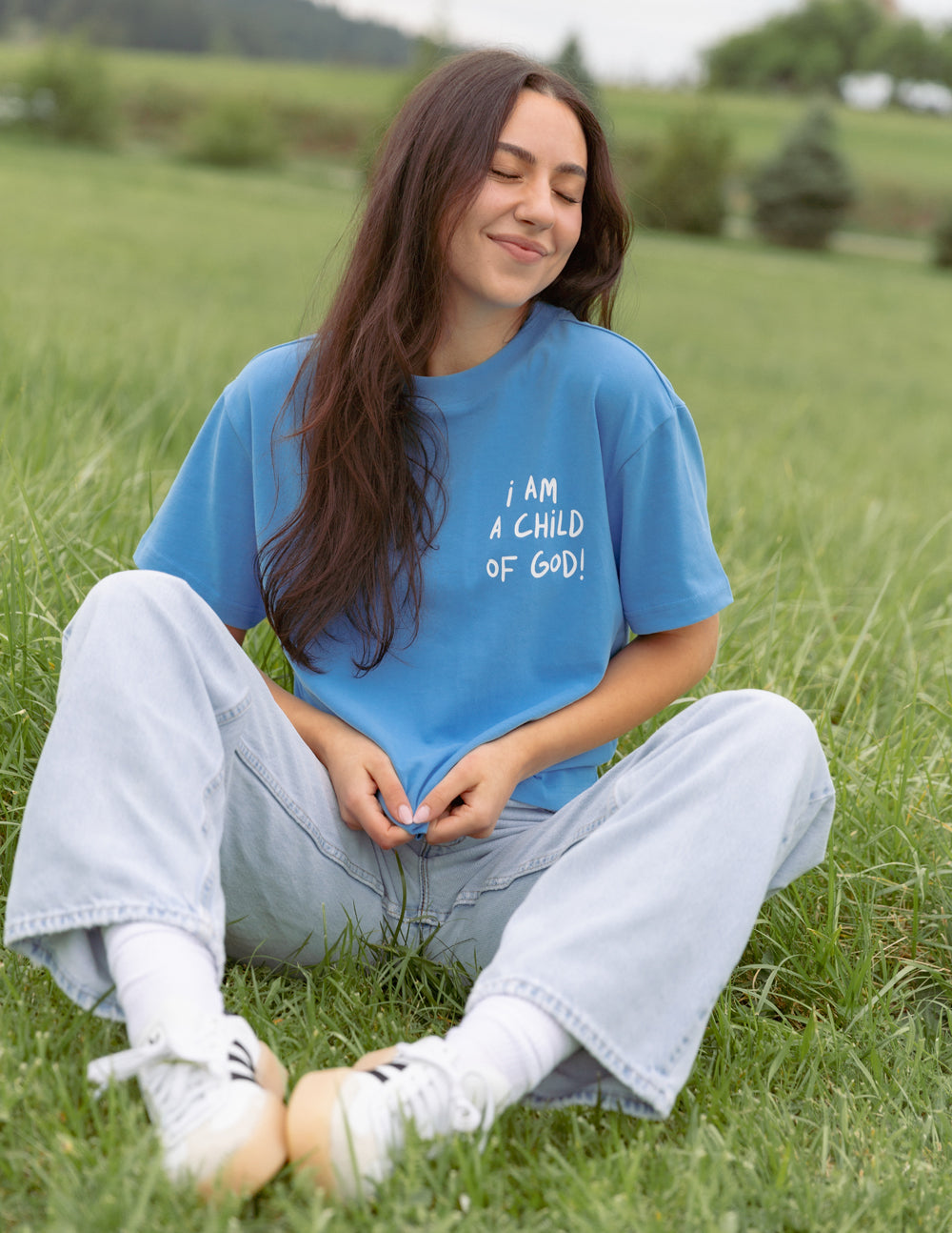 Elevated Faith Child of God Unisex Tee — Elevated Faith branding close-up