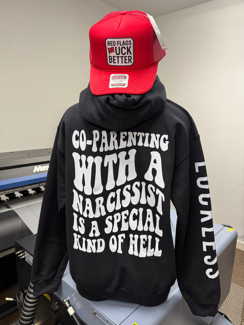 Luckless Outfitters Co-Parenting With A Narcissist Hoodie — detail close-up