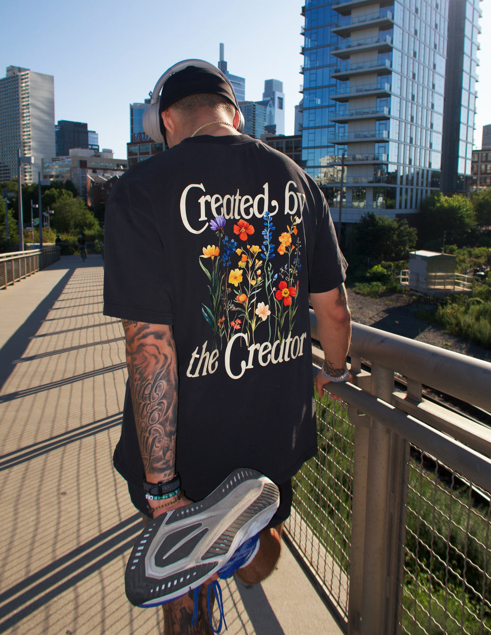 Elevated Faith Created by the Creator Unisex Tee — lifestyle worn / used context
