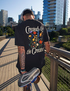 Elevated Faith Created by the Creator Unisex Tee — lifestyle worn / used context