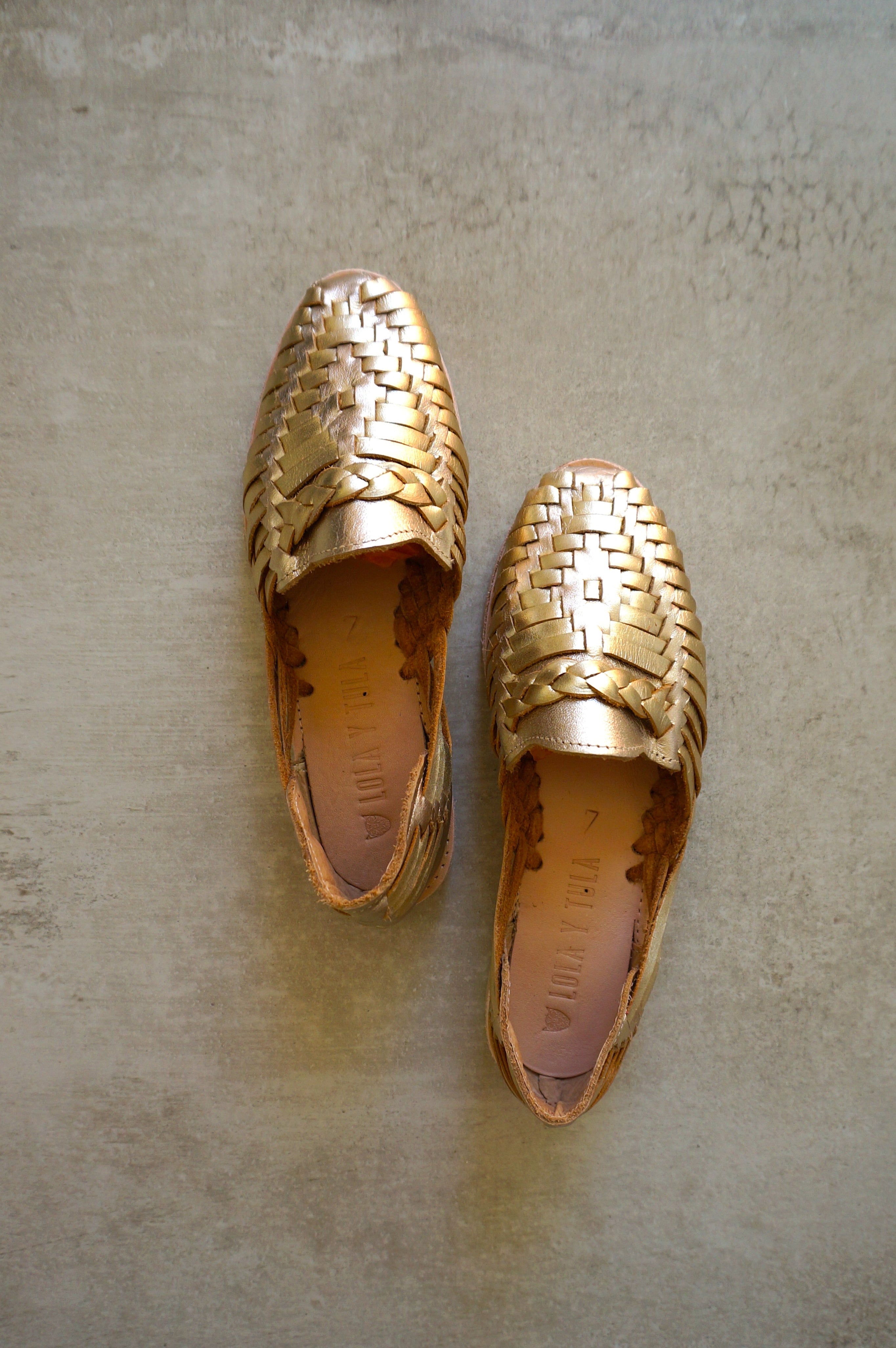 LOLA Y TULA Gold Leather Huarache — lifestyle context