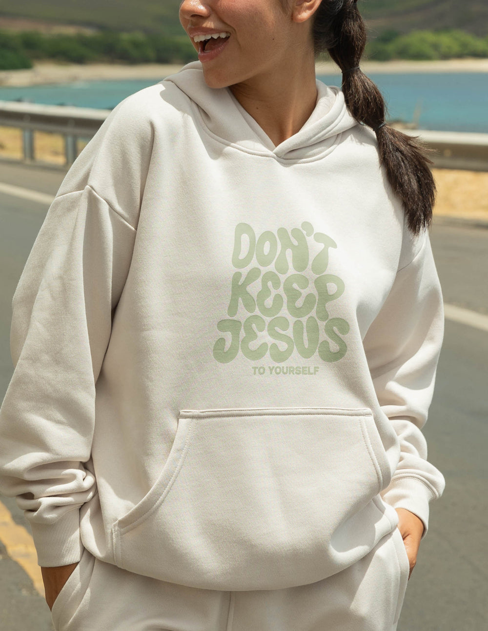 Elevated Faith Don't Keep Jesus to Yourself Unisex Hoodie — Elevated Faith branding close-up