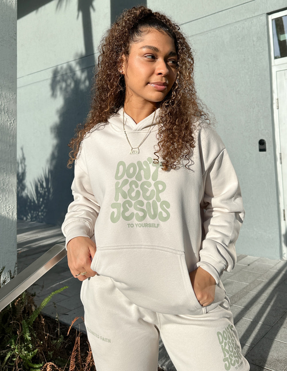 Elevated Faith Don't Keep Jesus to Yourself Unisex Hoodie — lifestyle worn / used context