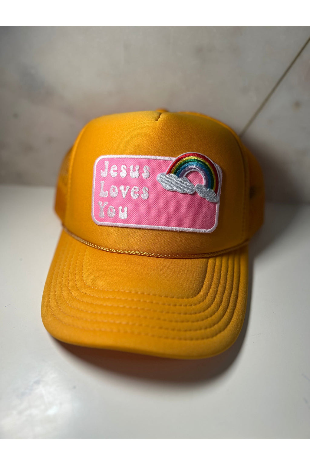 Pretty Little Patriot Pretty Little Patriot Jesus Loves You vintage trucker hat — Pretty Little Patriot branding close-up