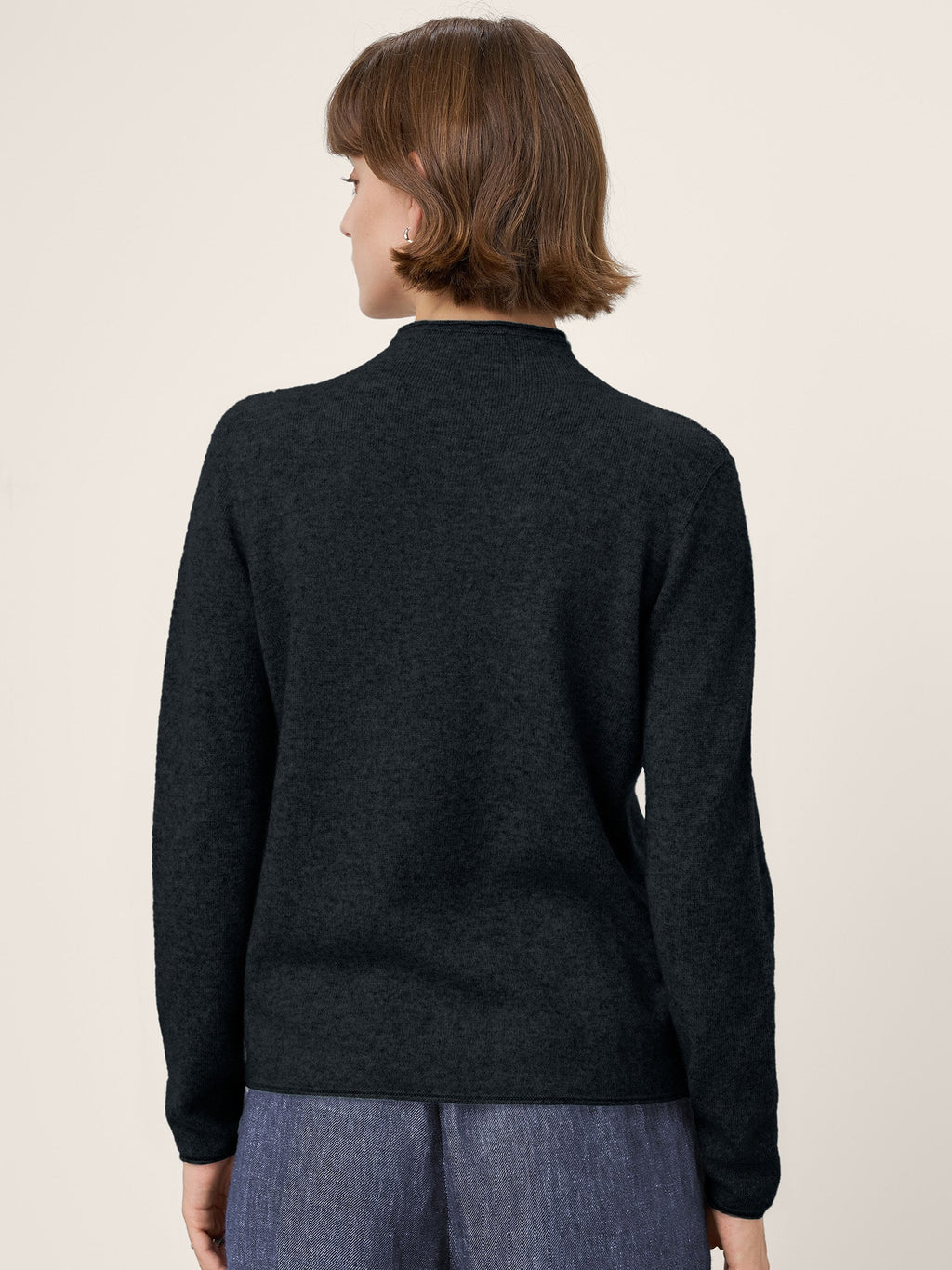 LINTICO Premium Cashmere Blend Hand-Finished Seamless Mock Neck Lettuce Edge Sweater ZELIE — in-use photo