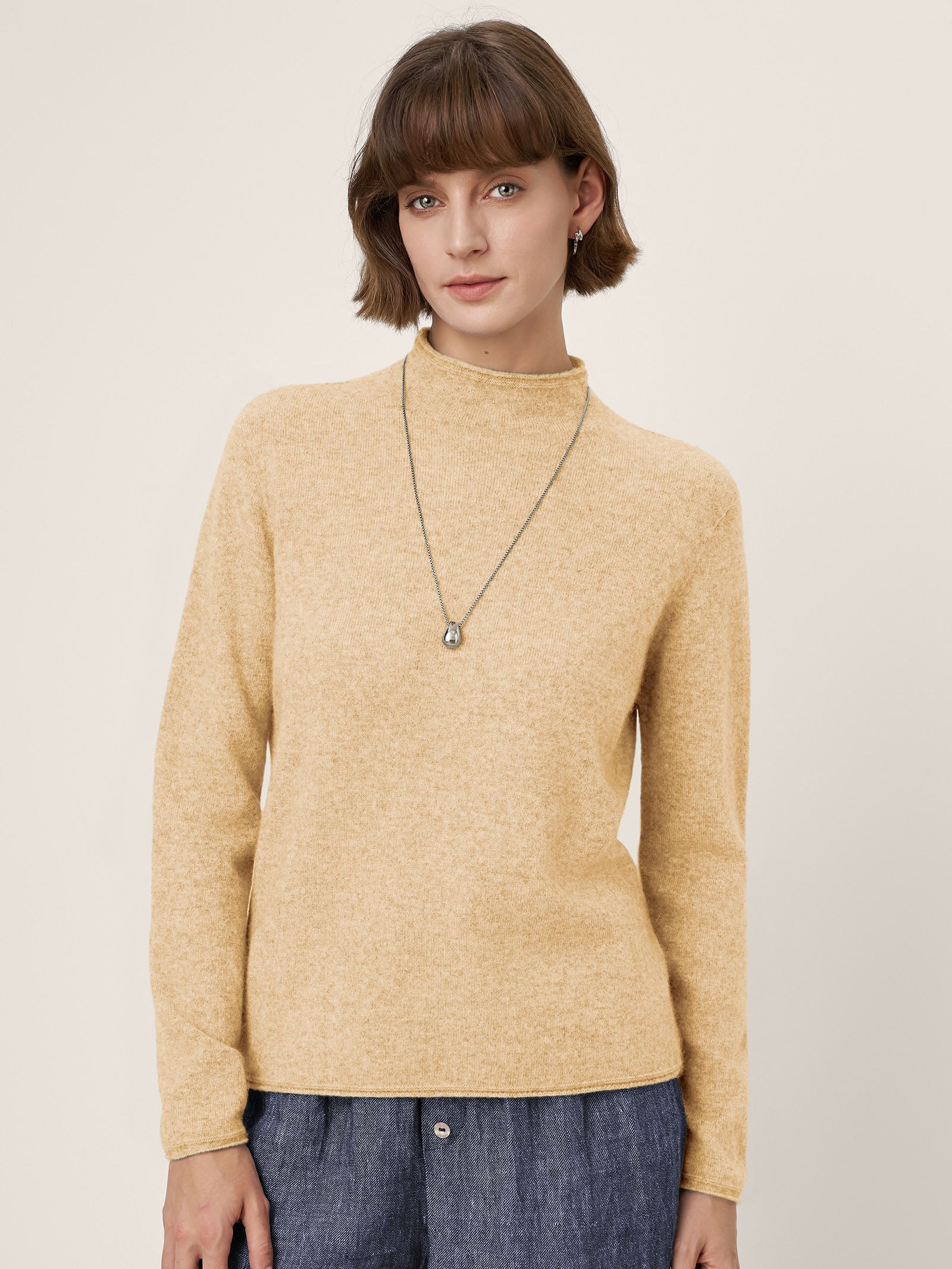 LINTICO Premium Cashmere Blend Hand-Finished Seamless Mock Neck Lettuce Edge Sweater ZELIE — flat-lay composition