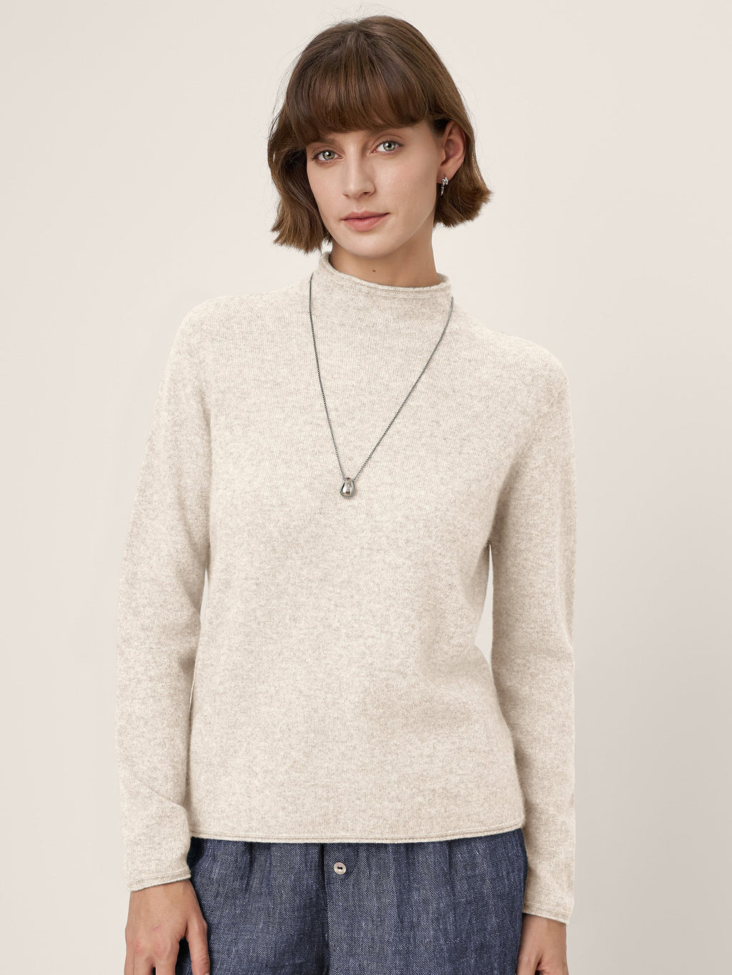 LINTICO Premium Cashmere Blend Hand-Finished Seamless Mock Neck Lettuce Edge Sweater ZELIE — fabric or material detail