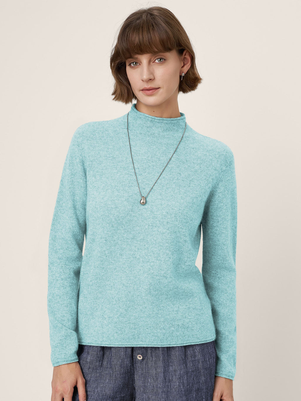 LINTICO Premium Cashmere Blend Hand-Finished Seamless Mock Neck Lettuce Edge Sweater ZELIE — detail close-up