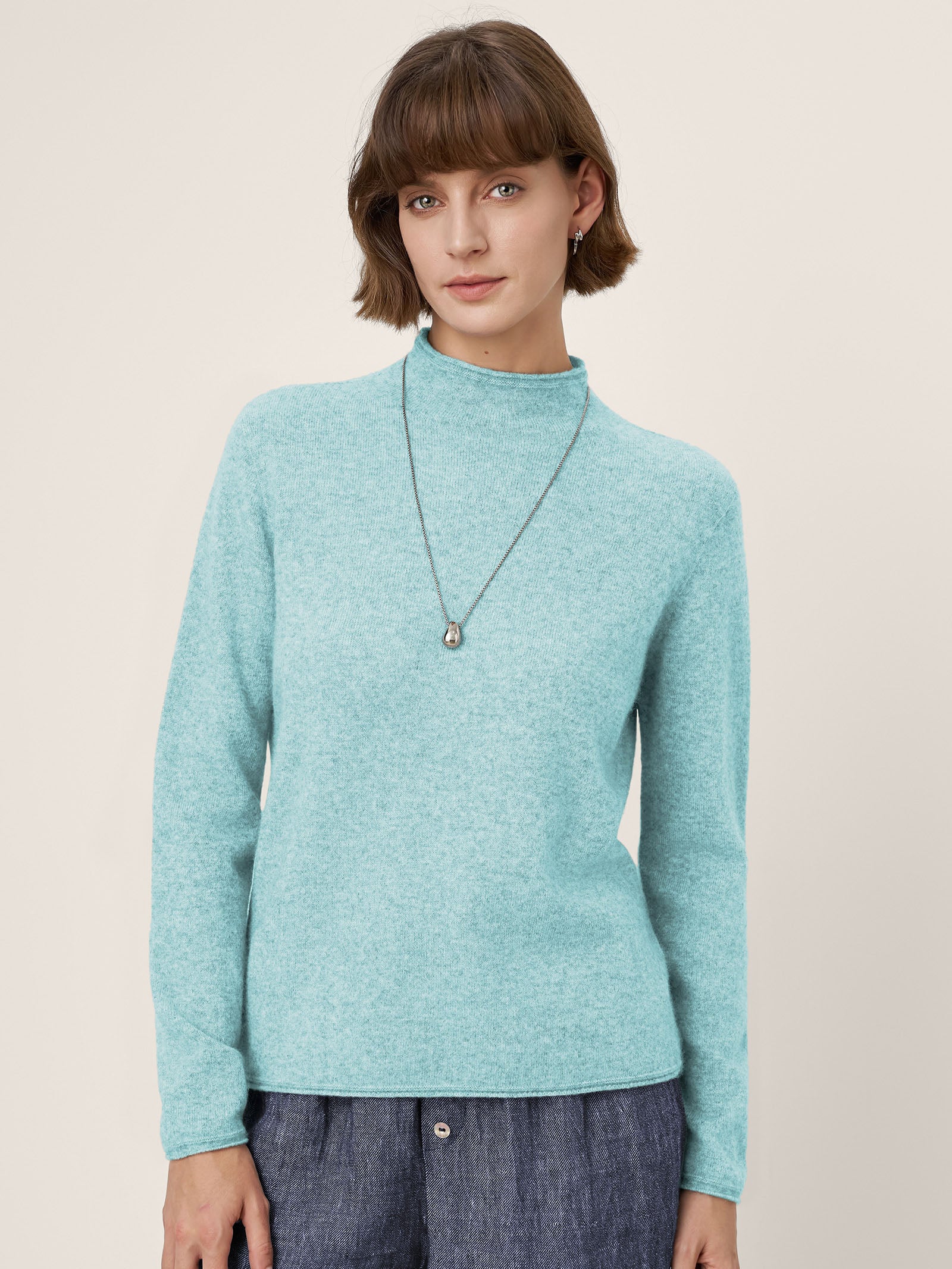 LINTICO Premium Cashmere Blend Hand-Finished Seamless Mock Neck Lettuce Edge Sweater ZELIE — detail close-up