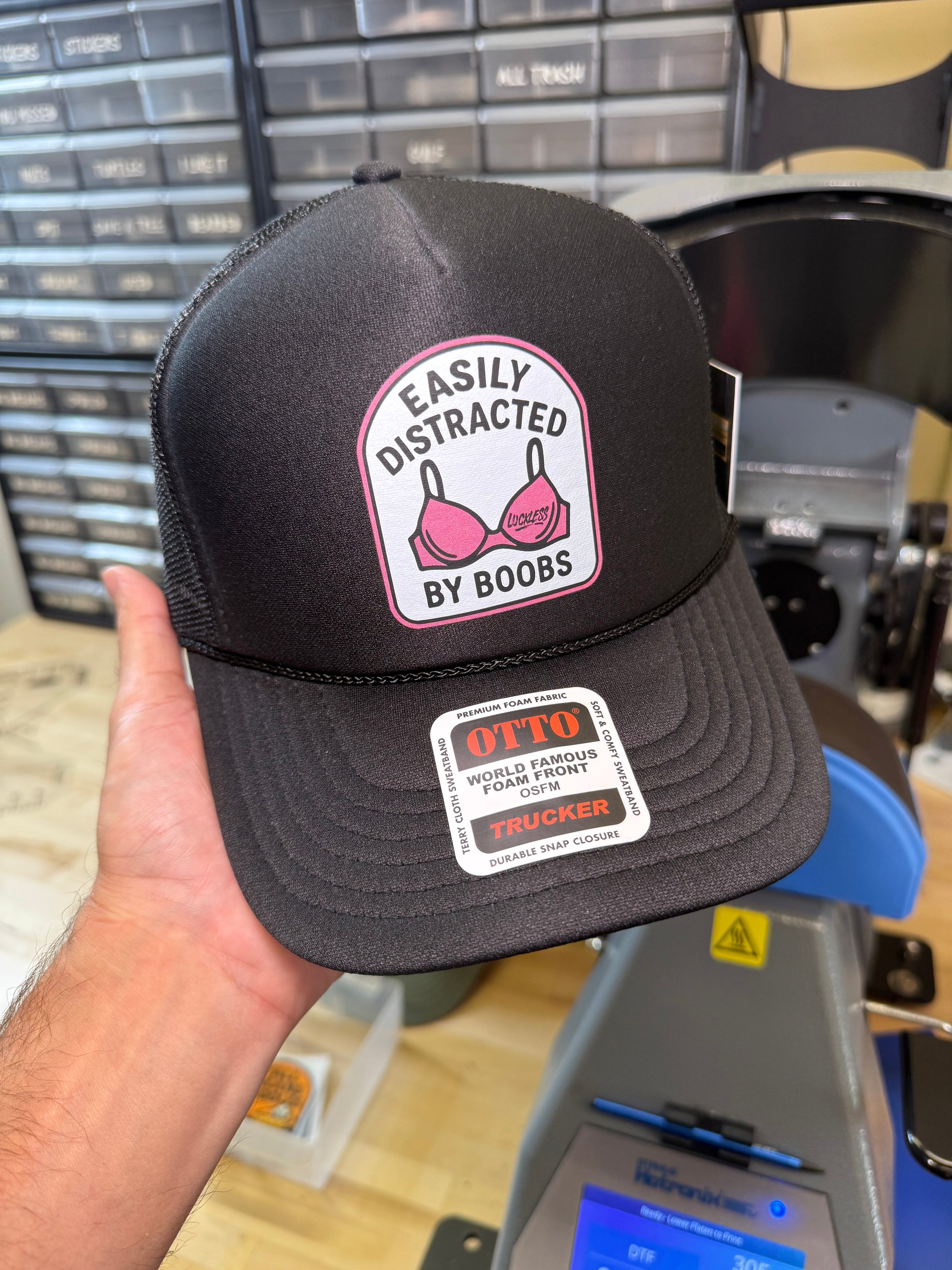 Luckless Outfitters Easily Distracted Trucker Hat — side view