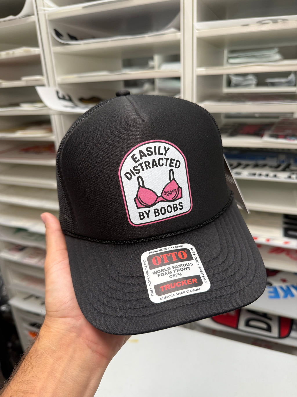 Luckless Outfitters Easily Distracted Trucker Hat — lifestyle context