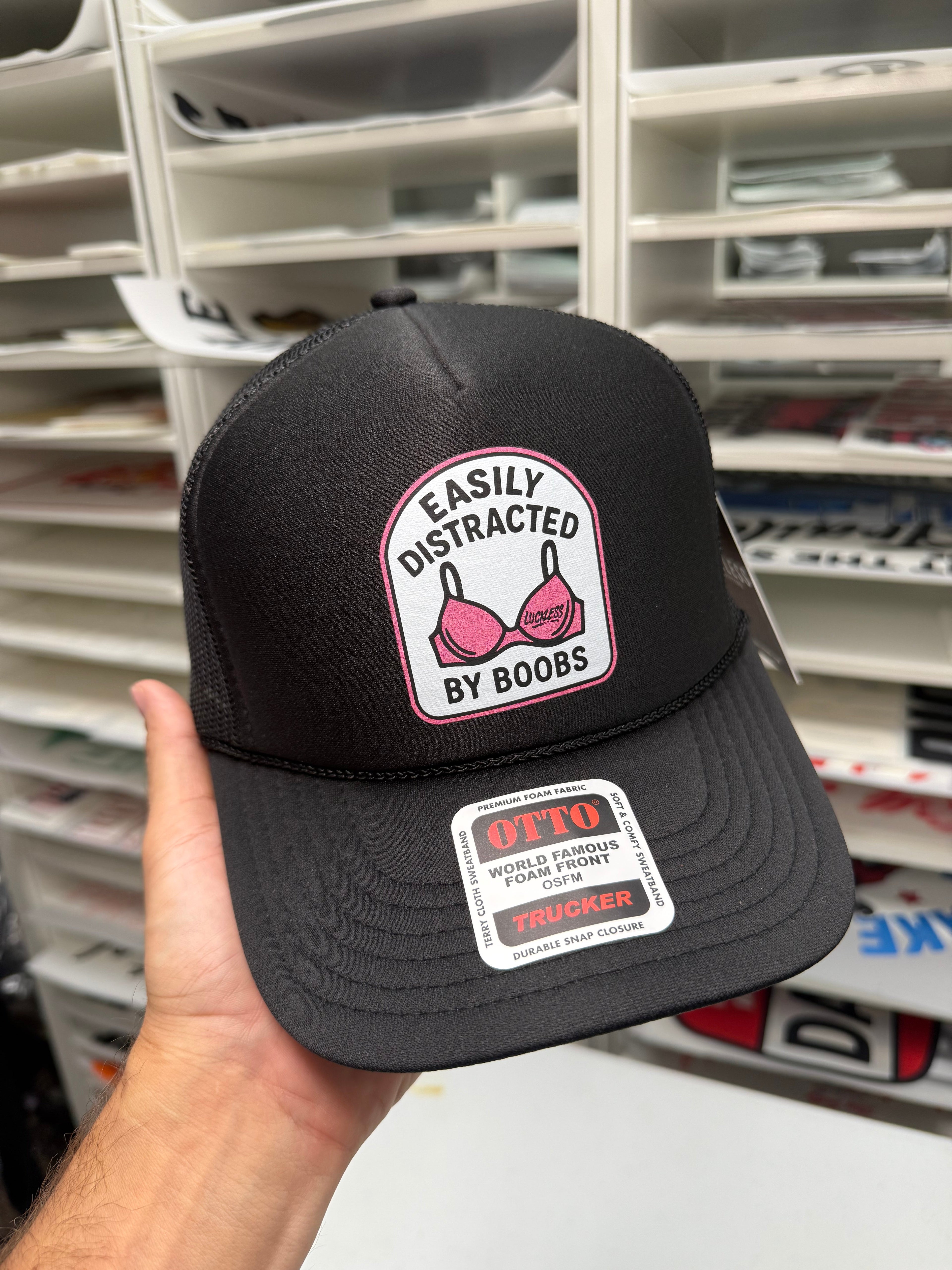 Luckless Outfitters Easily Distracted Trucker Hat — lifestyle context