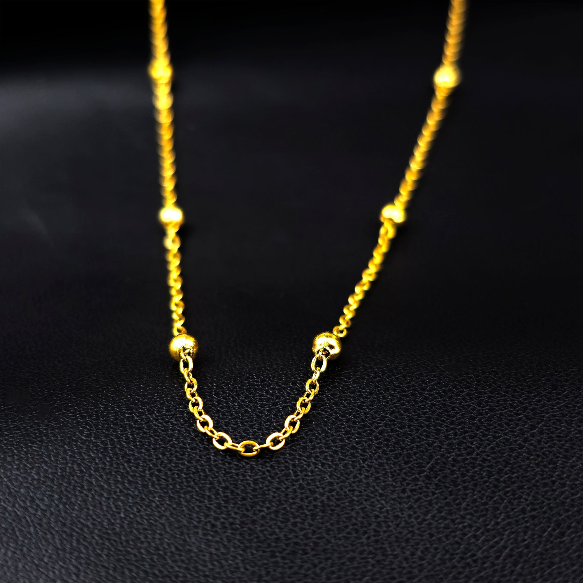 BodyCandy Stainless Steel Ball Gold Tone PVD Station Necklace Satellite Chain Layering Necklace — detail close-up