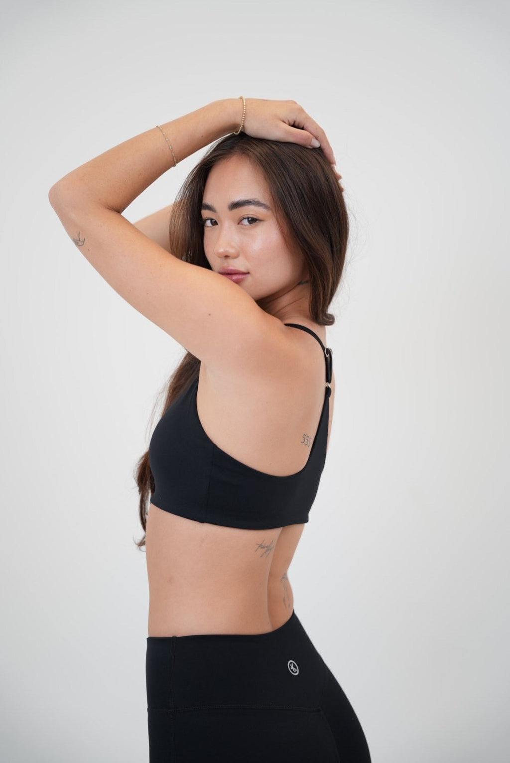 KIMITH BRAND I Live in Luxury Black Sports Bra — lifestyle context