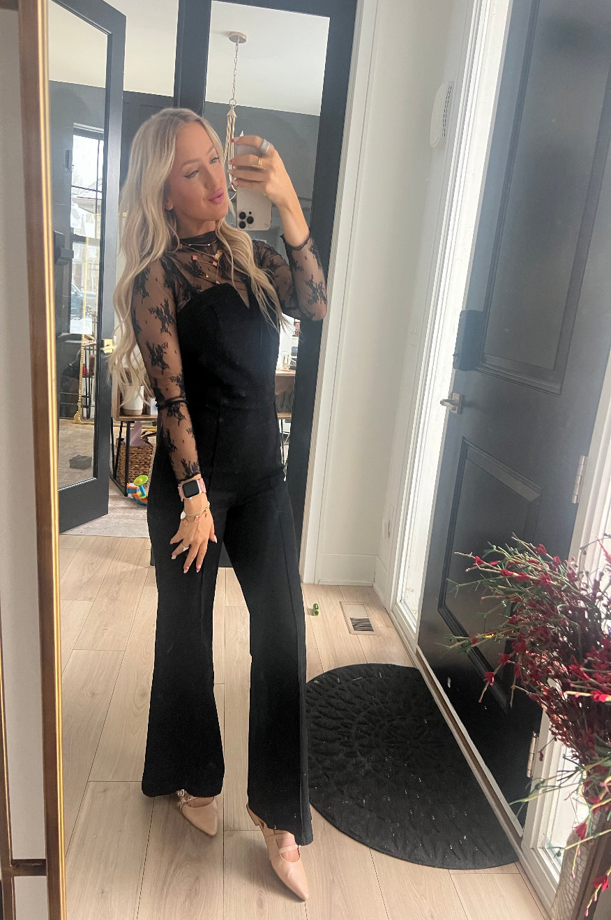 Pretty Little Patriot Pretty Little Patriot Black Denim Glam Jumpsuit — Pretty Little Patriot branding close-up