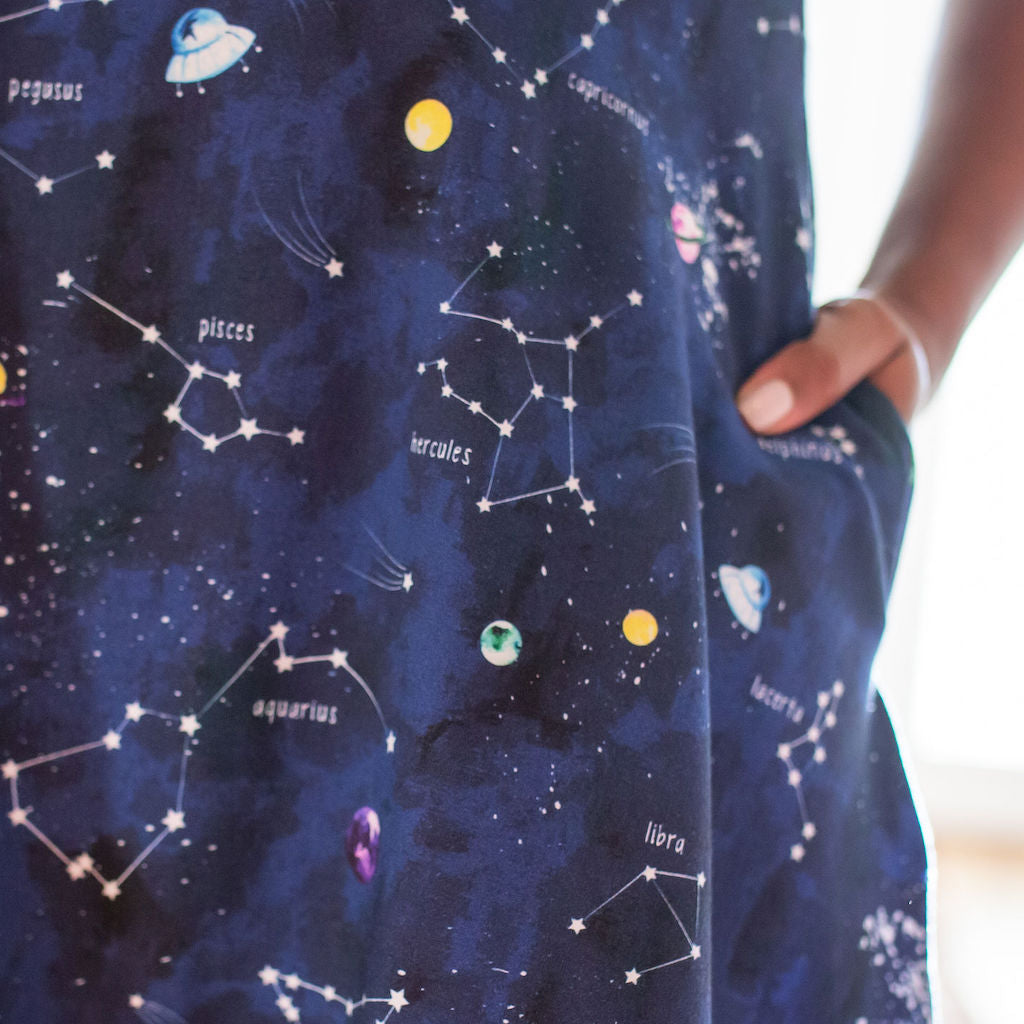 Princess Awesome & Boy Wonder Adult "Cosmic Compass" Constellations Sleeveless Dress with Pockets — Princess Awesome & Boy Wonder branding close-up