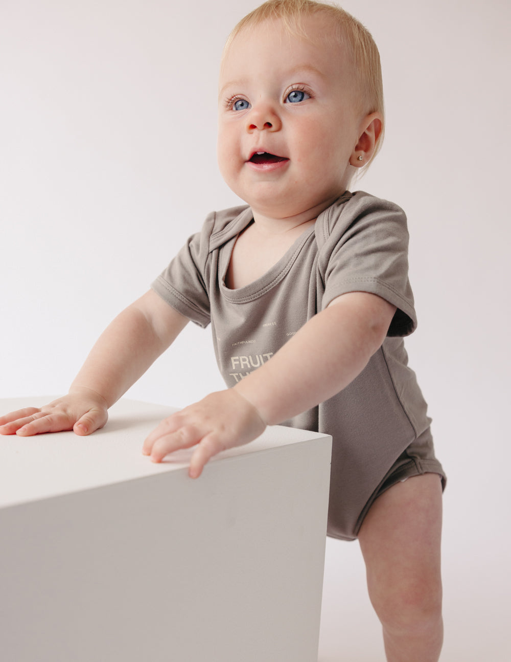 Elevated Faith Fruit of the Spirit Onesie — lifestyle context