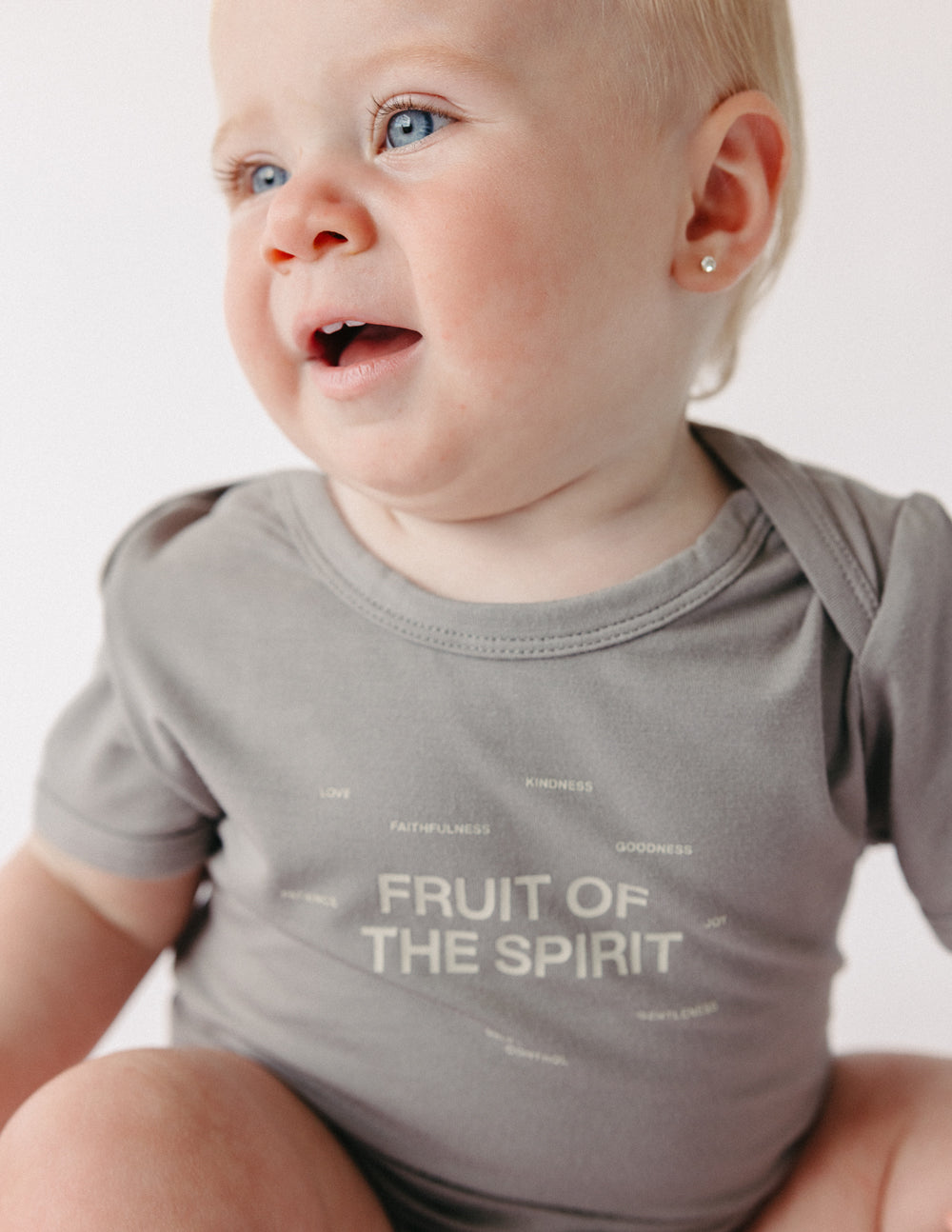 Elevated Faith Fruit of the Spirit Onesie — side view