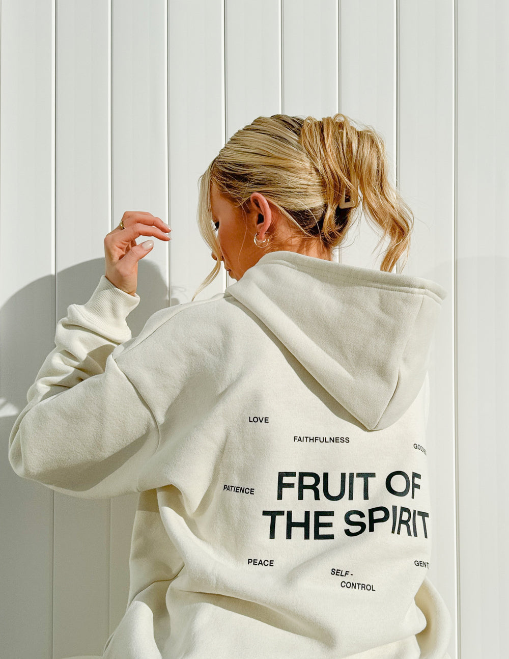 Elevated Faith Fruit of the Spirit Unisex Hoodie — Elevated Faith branding close-up