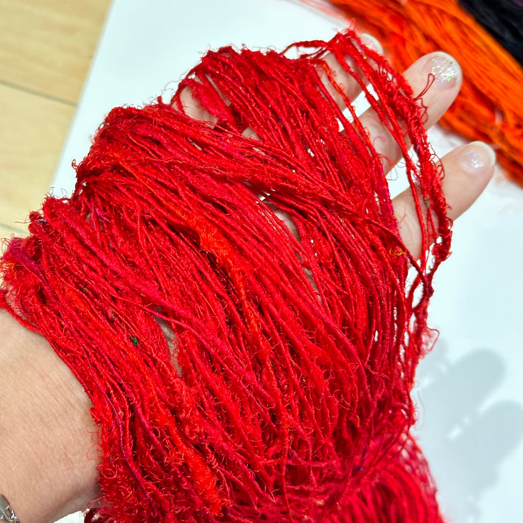 Darn Good Yarn Recycled Silk Yarn "Lux Adventure" — flat-lay composition