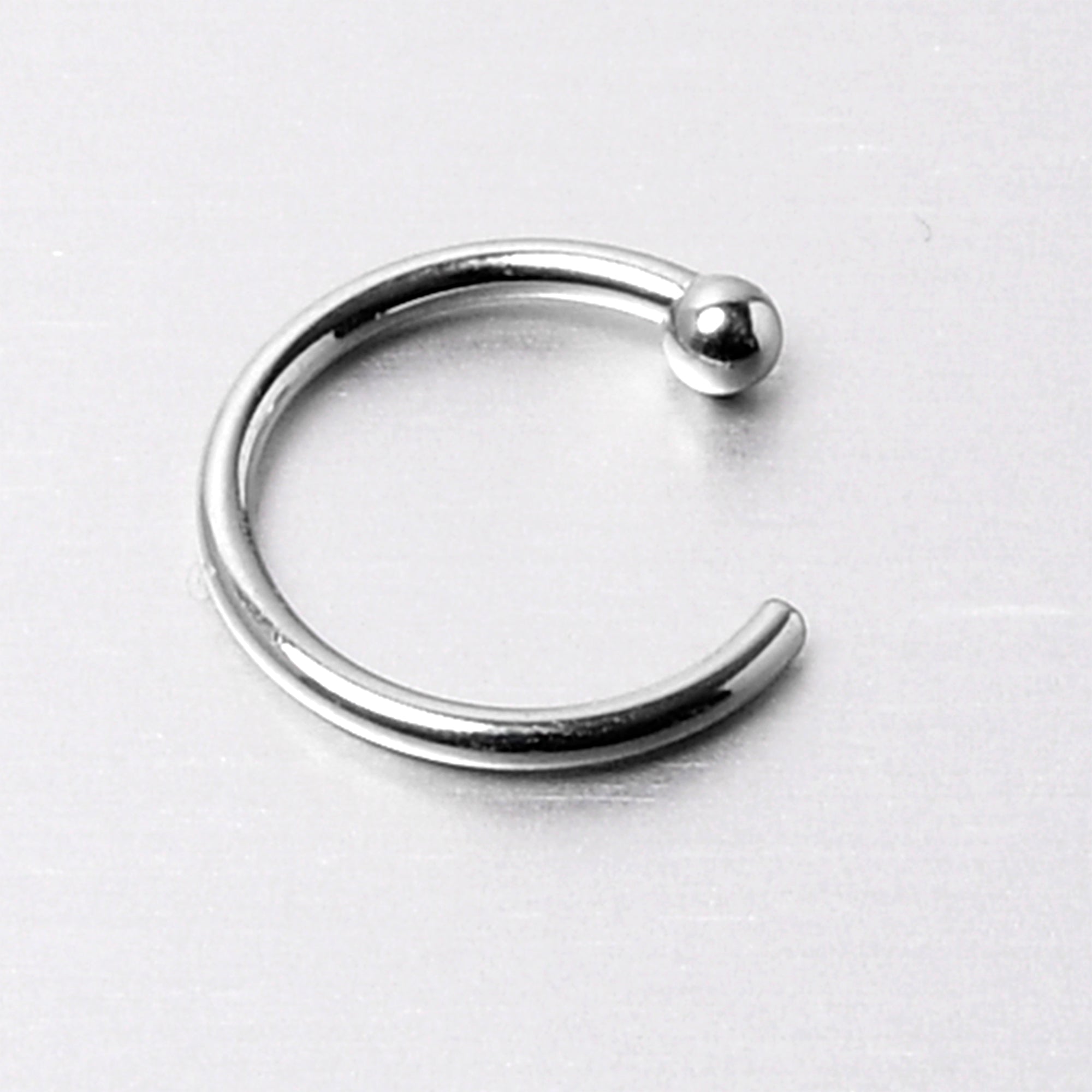 BodyCandy 20G 5/16 Solid 14K White Gold Nose Hoop — size reference