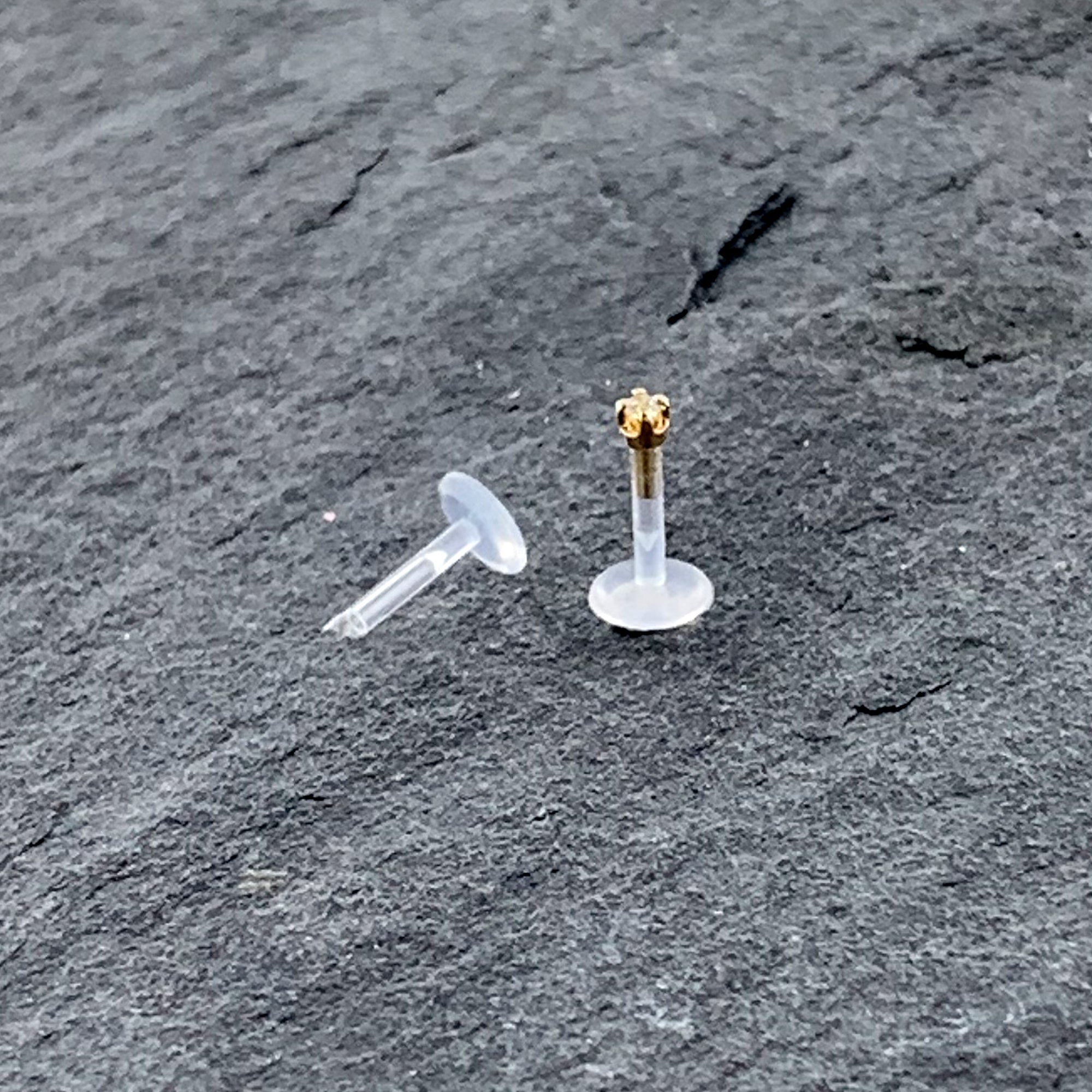 BodyCandy 16G 1/4 Solid 14K Yellow Gold 1.5mm CZ Bioplast Push in Cartilage Earring — back view