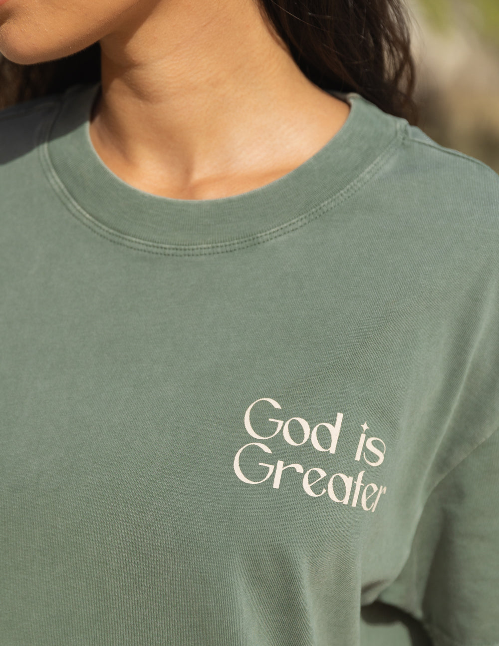 Elevated Faith God Is Greater Unisex Tee — Elevated Faith branding close-up