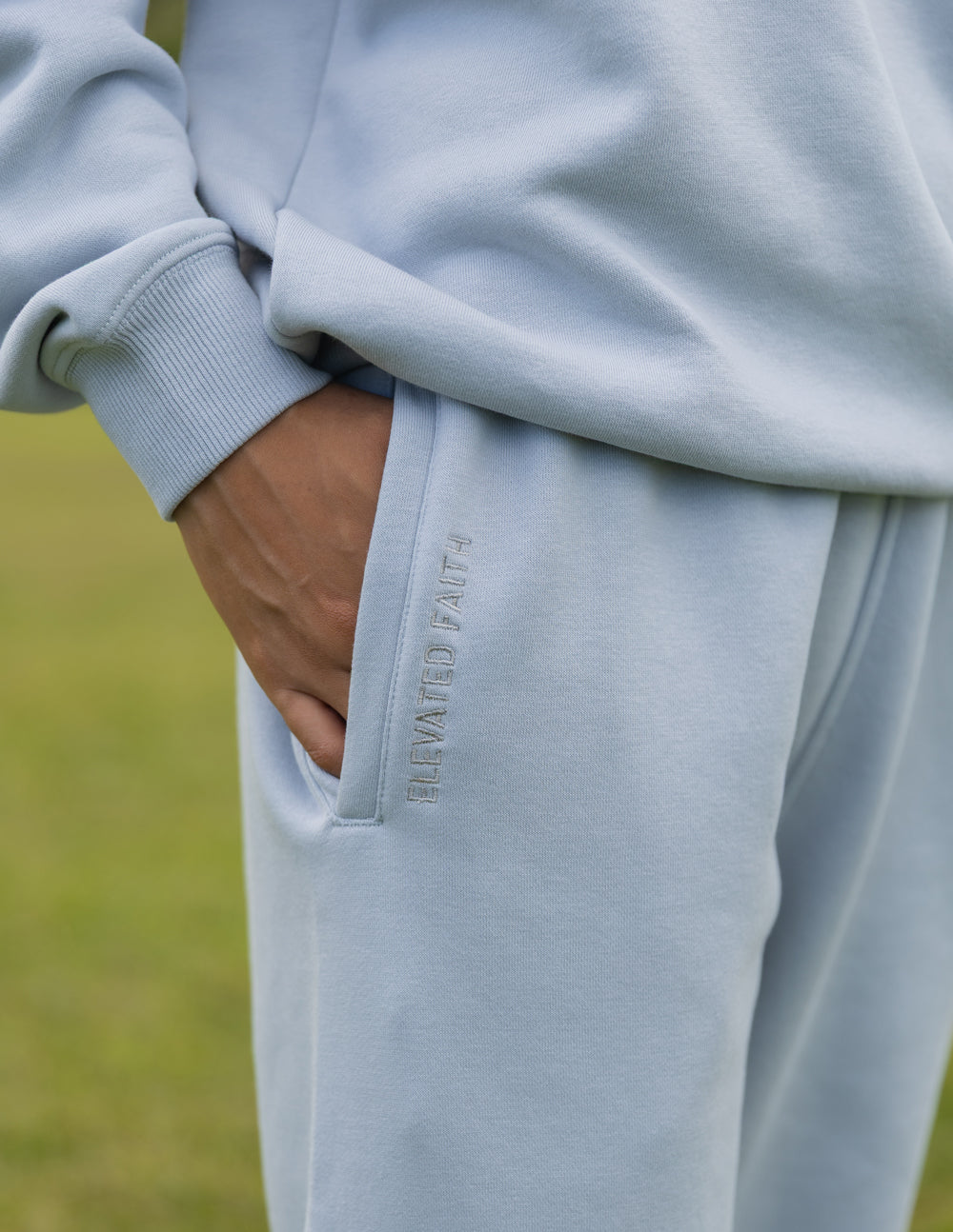 Elevated Faith God Is Here Unisex Sweatpant — Elevated Faith branding close-up