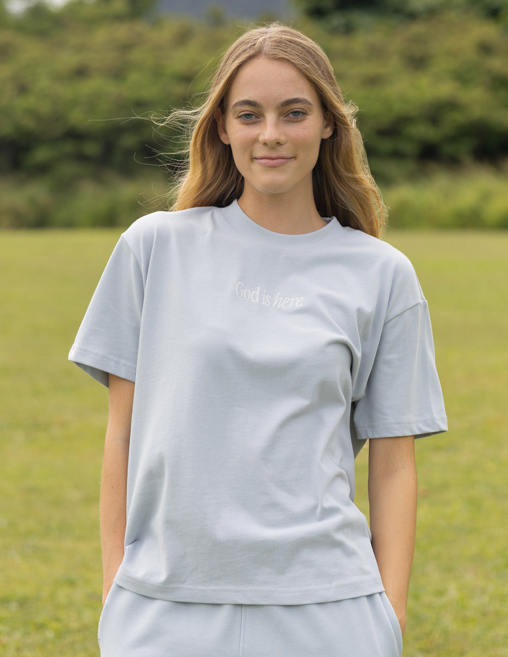 Elevated Faith God Is Here Unisex Tee — main product shot
