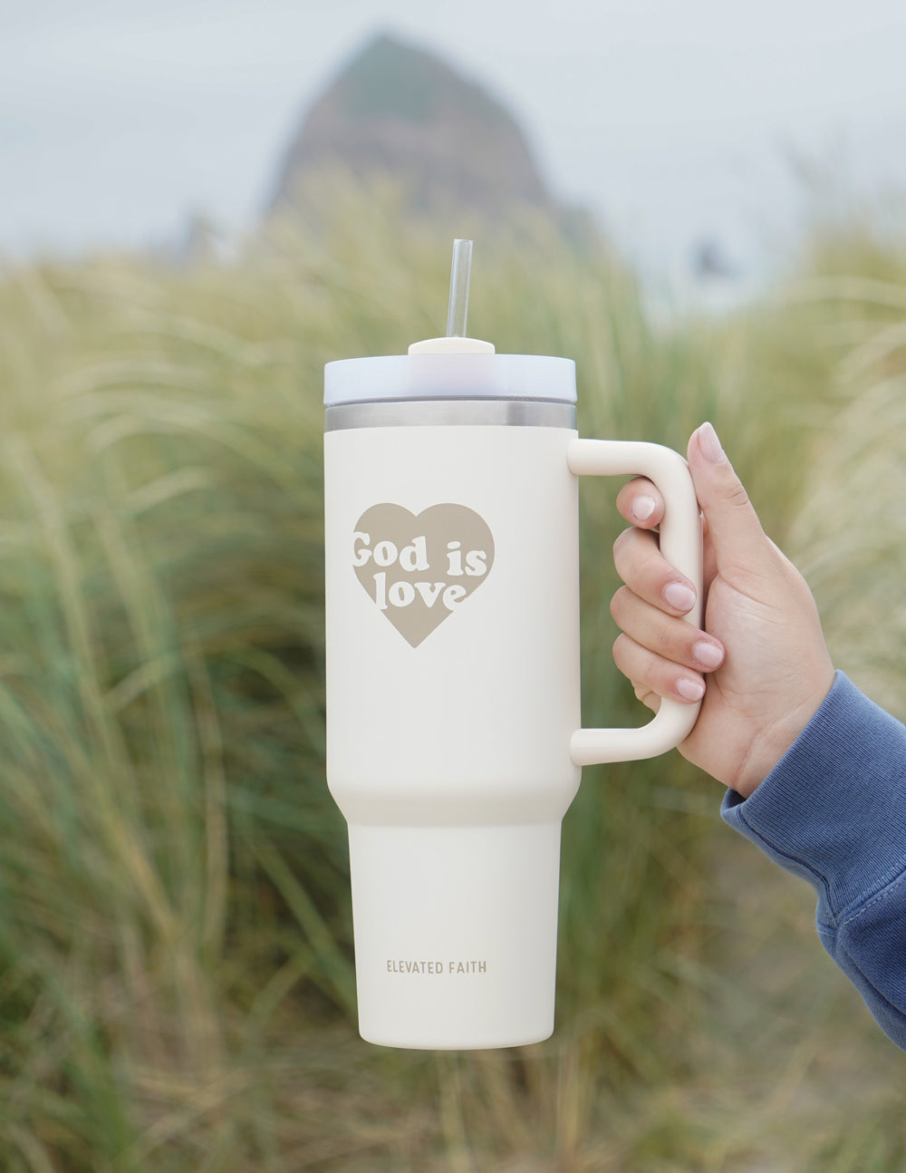 Elevated Faith God is Love 40 oz Tumbler — in-use photo