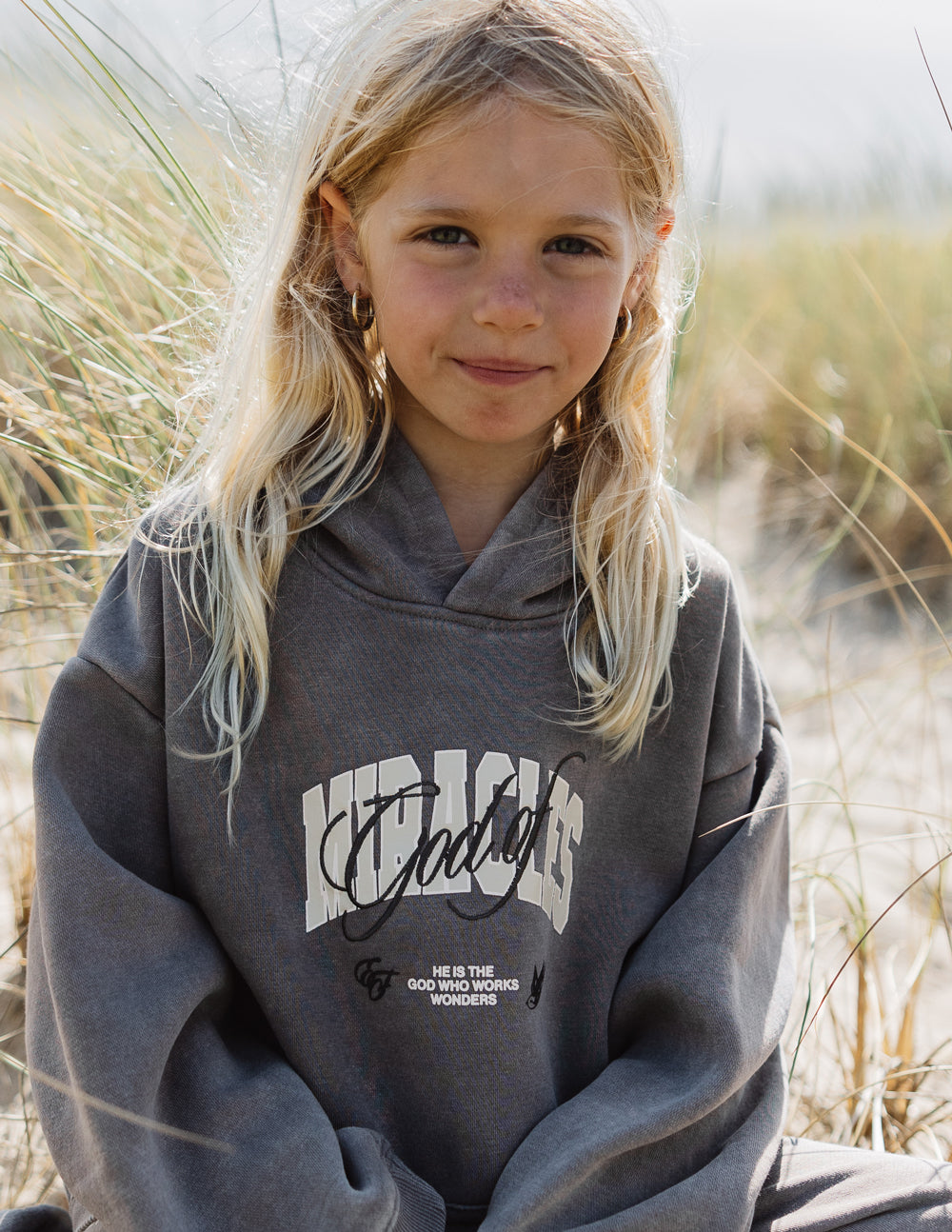 Elevated Faith God of Miracles Kids Hoodie — main product shot
