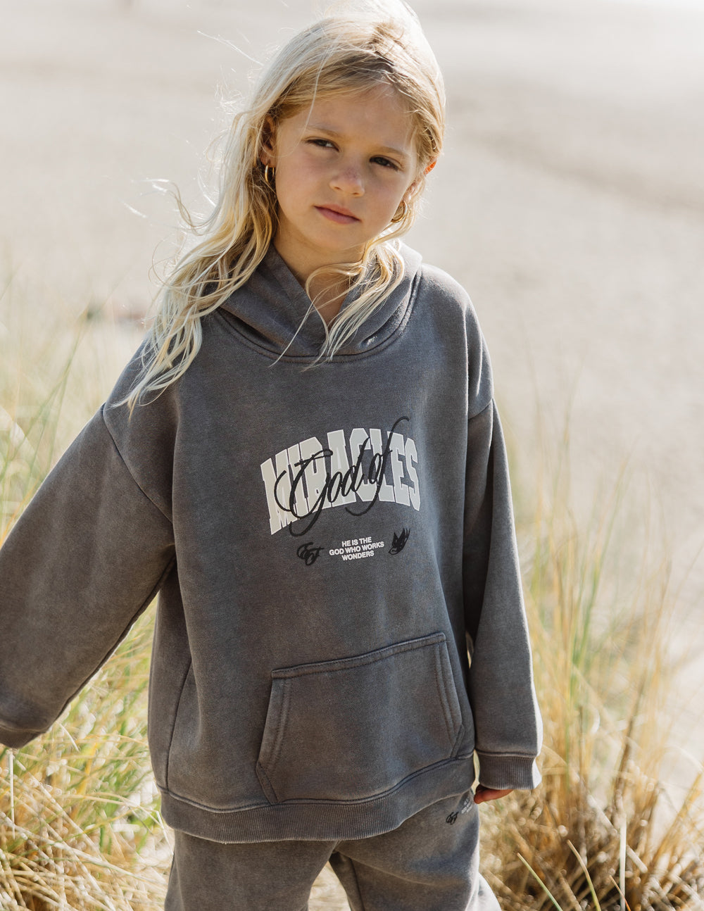 Elevated Faith God of Miracles Kids Hoodie — detail close-up