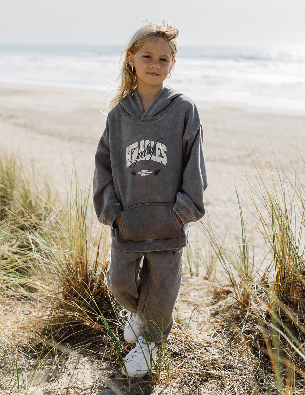 Elevated Faith God of Miracles Kids Hoodie — lifestyle context