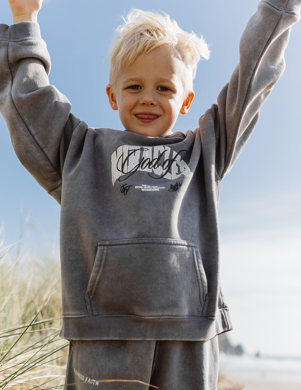 Elevated Faith God of Miracles Kids Hoodie — side view