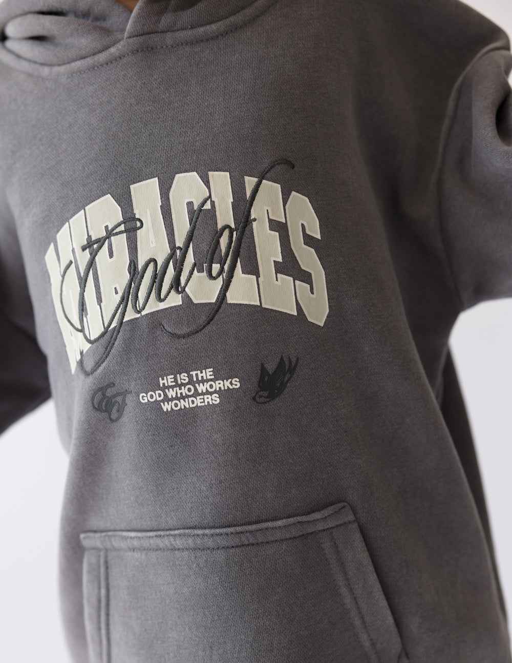 Elevated Faith God of Miracles Kids Hoodie — in-use photo