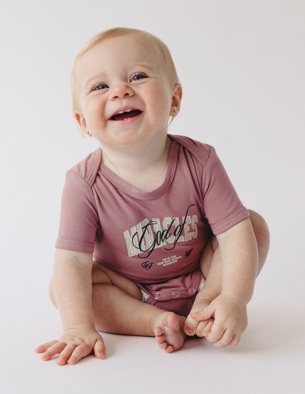 Elevated Faith God of Miracles Onesie — main product shot