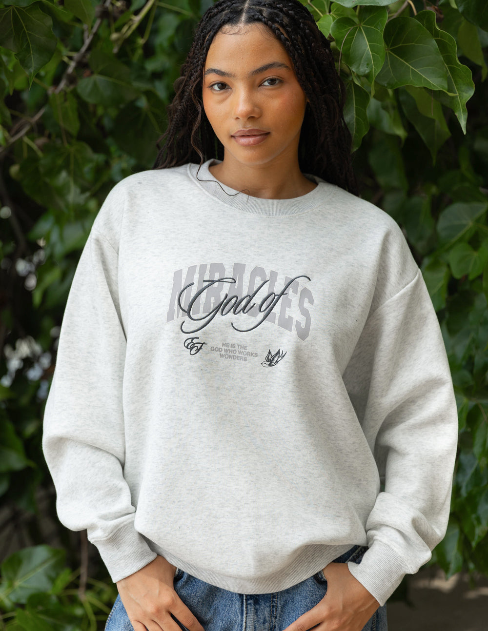 Elevated Faith God of Miracles Unisex Crewneck — lifestyle context