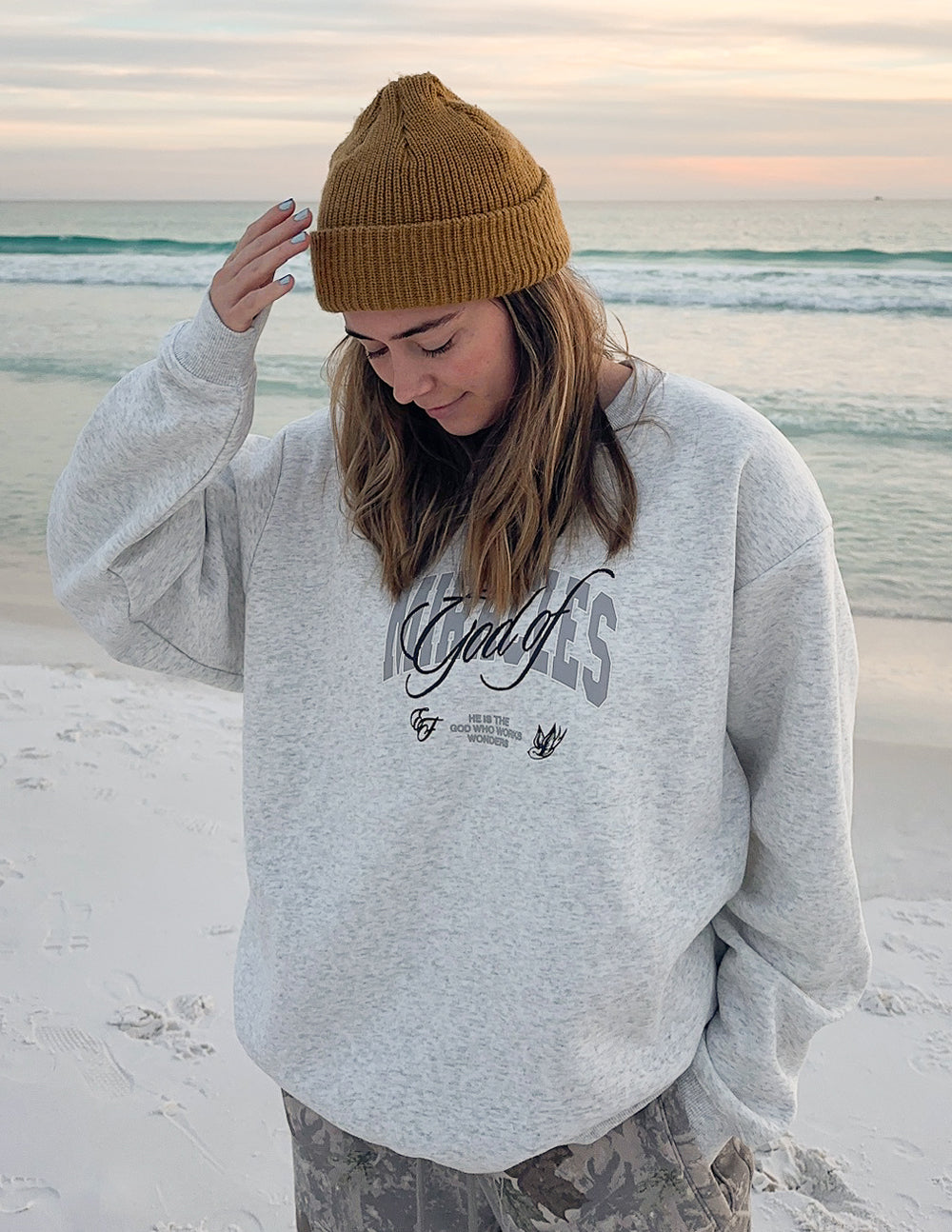 Elevated Faith God of Miracles Unisex Crewneck — in-use photo