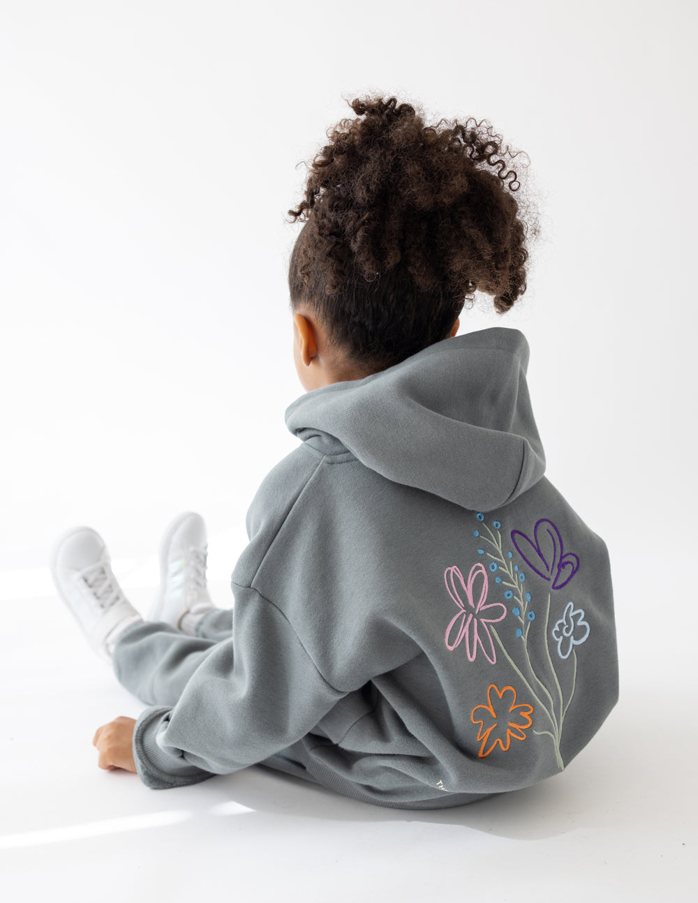 Elevated Faith God's Still Working Kids Hoodie — side view