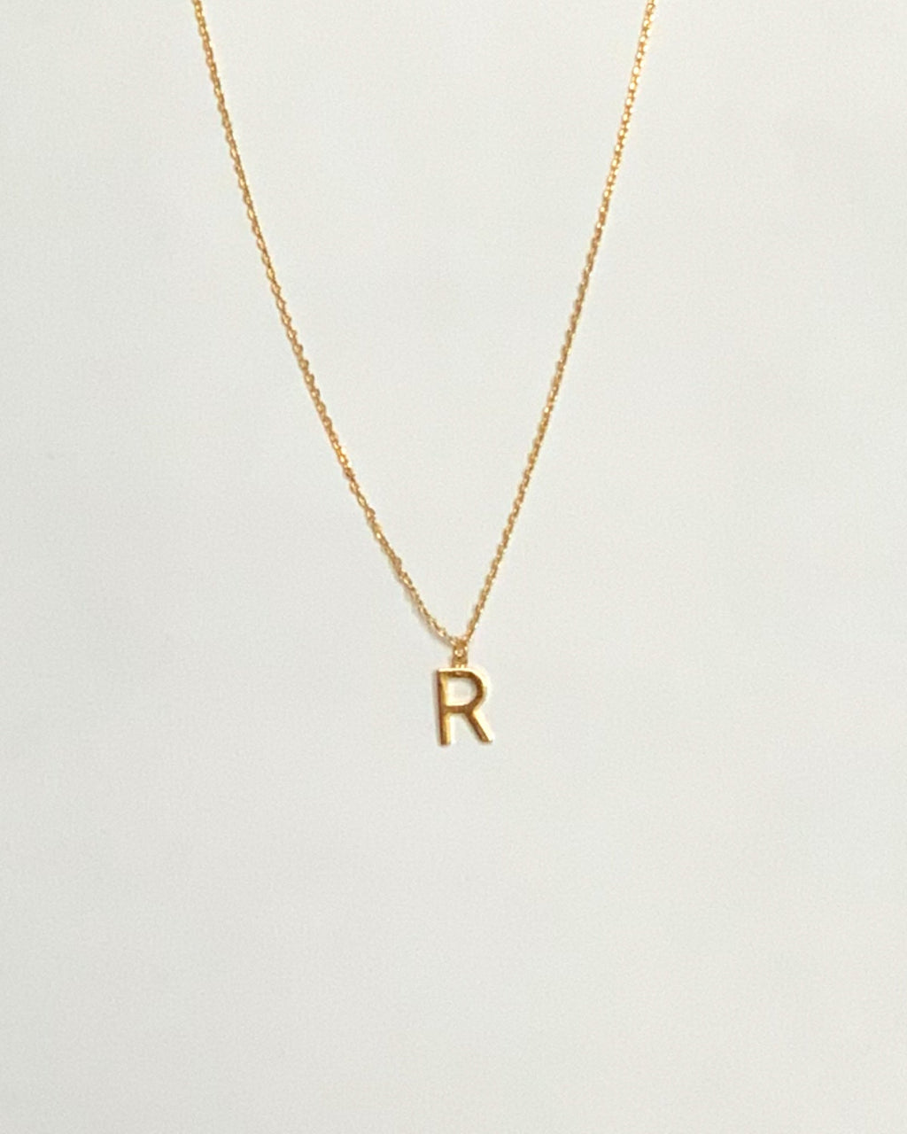 KADOU BOUTIQUE Letter Pendent Necklace — product on model